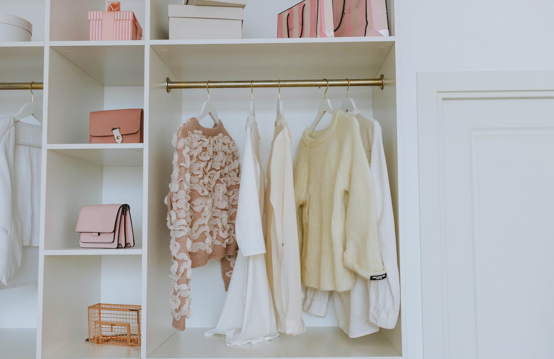 White wooden closet with clothes and other items | Source: Pexels