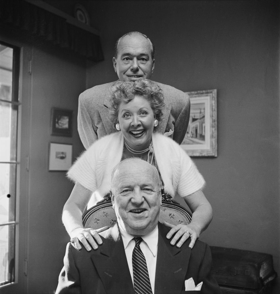 Actress Vivian Vance with William Frawley (bottom), and her husband, actor Philip Ober (top), at home, USA, circa 1955. | Photo: Getty Images