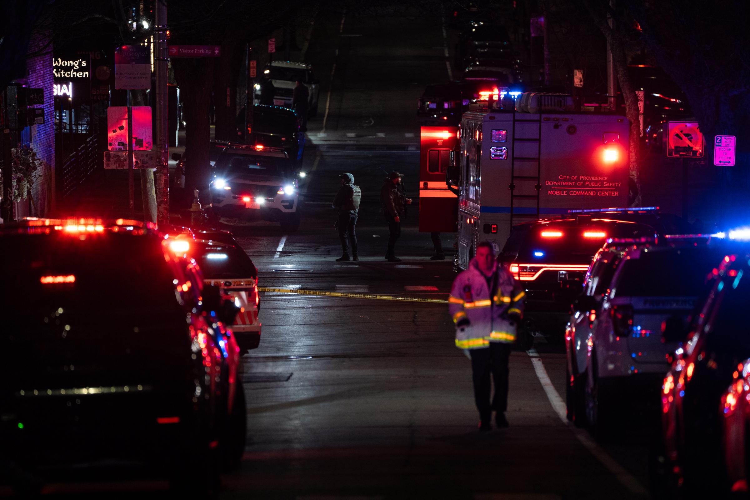 Emergency personnel escort students from a Brown University building on December 13, 2025, in Providence, Rhode Island, following a mass shooting | Source: Getty Images
