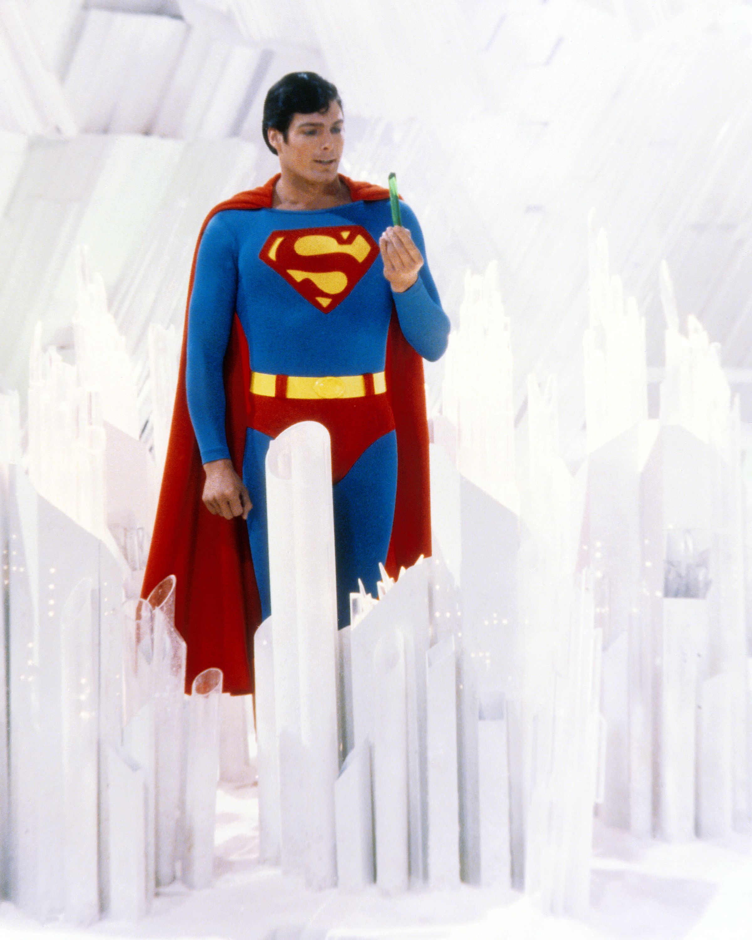 Superman, played by American actor Christopher Reeve holds a green crystal at the Fortress of Solitude in a promotional still from "Superman"1978 | Source: Getty Images