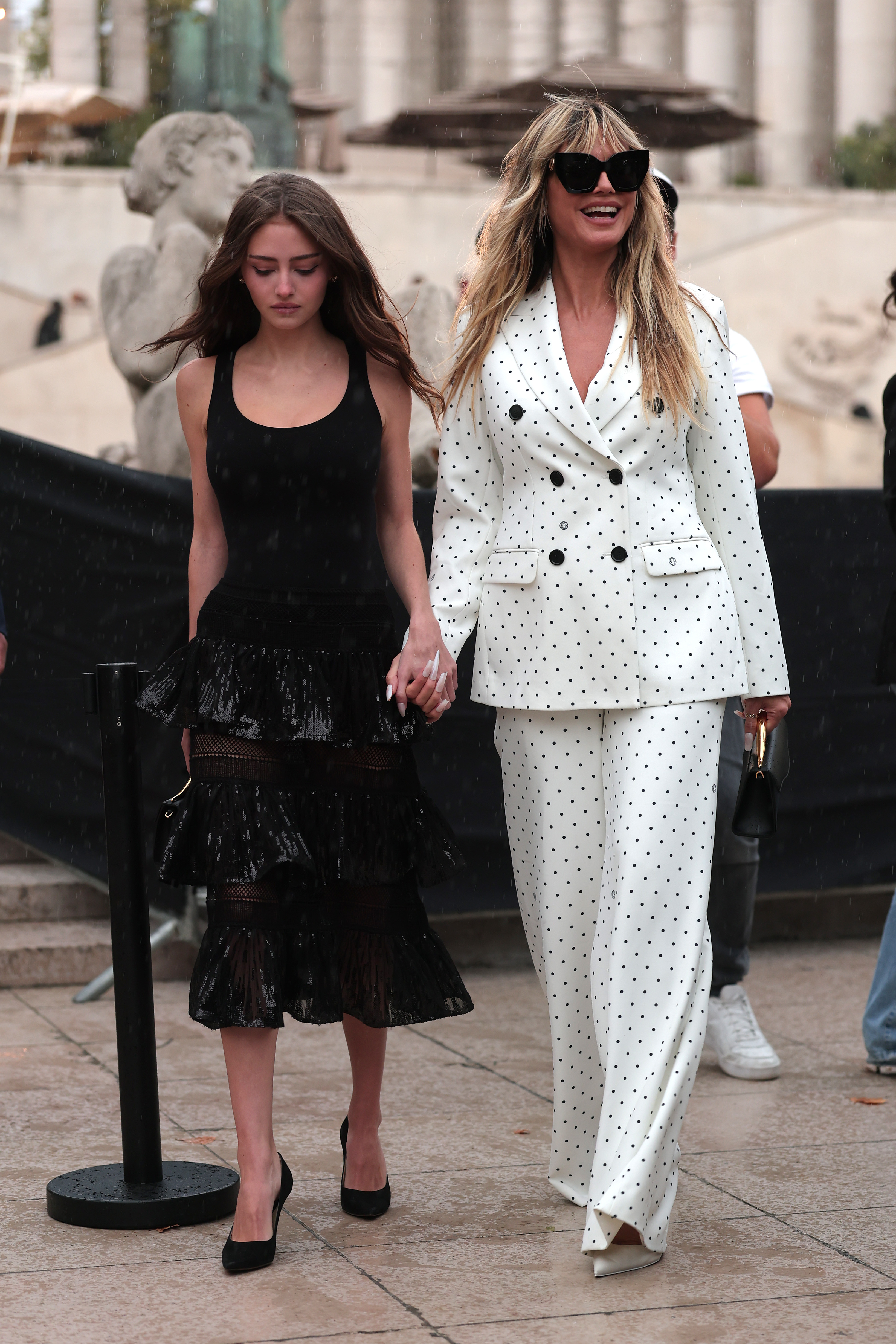 A day later, Heidi and Leni Klum attended the Elie Saab Womenswear Spring/Summer 2026 show. Heidi opted for a chic white and black polka-dot two-piece suit featuring a double-breasted blazer and flared trousers. Meanwhile, Leni looked timeless in a classic black midi dress.