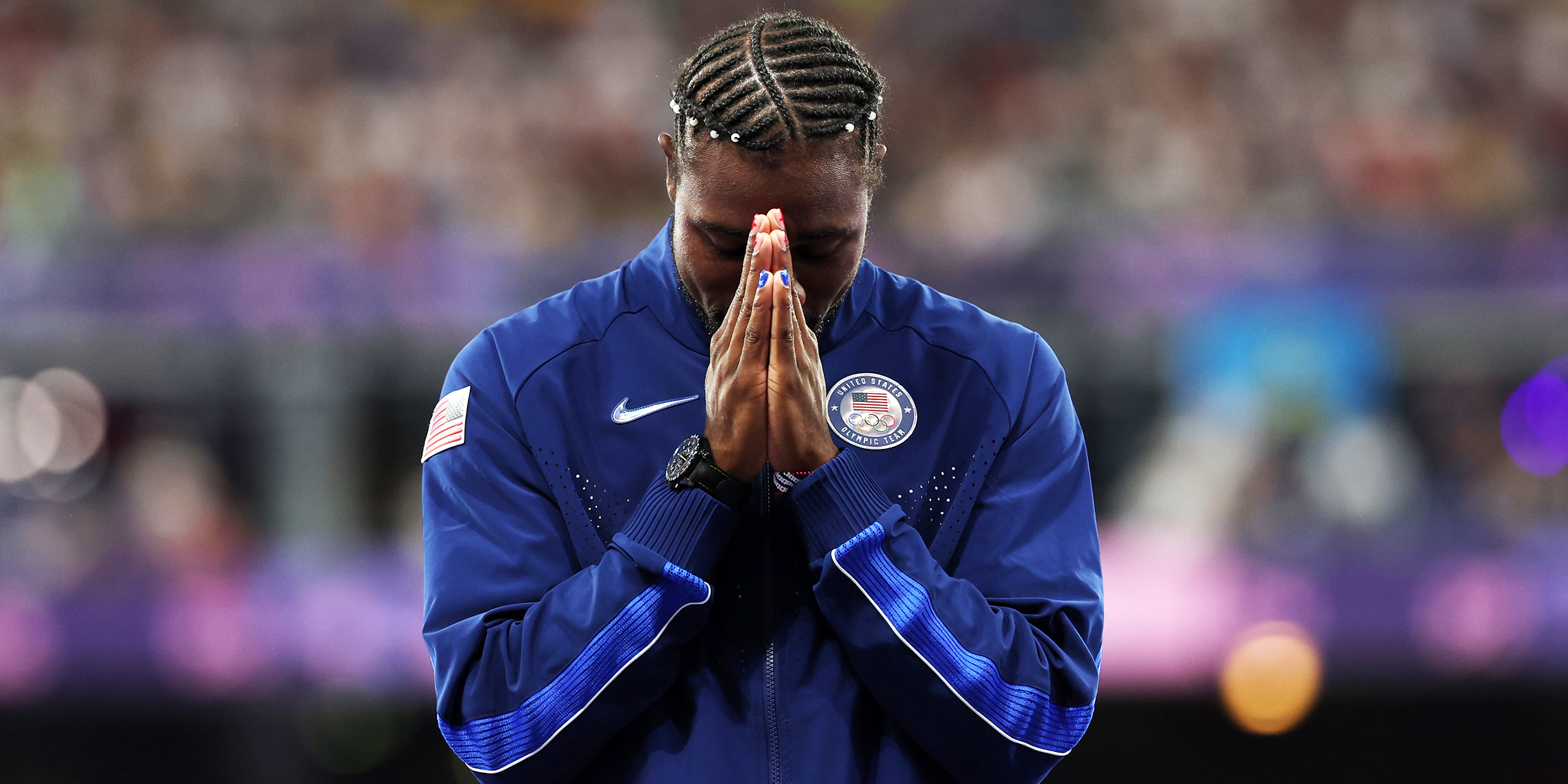 Noah Lyles of Team United States celebrates on the podium during the Men's 100m medal ceremony on day ten of the Olympic Games Paris 2024 at Stade de France on August 05, 2024 in Paris, France | Source: Getty Images