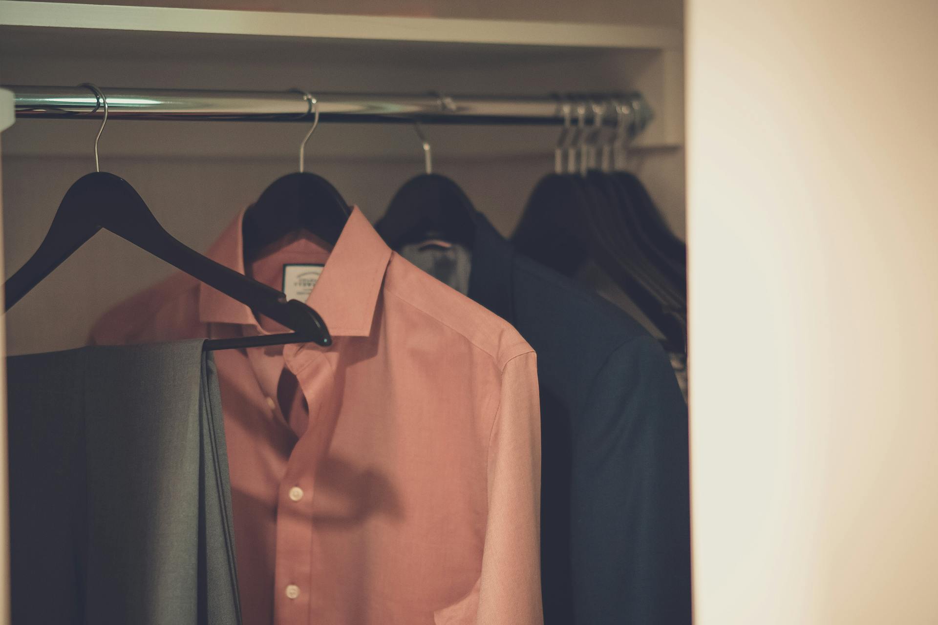 Clothes hanging in a closet | Source: Pexels