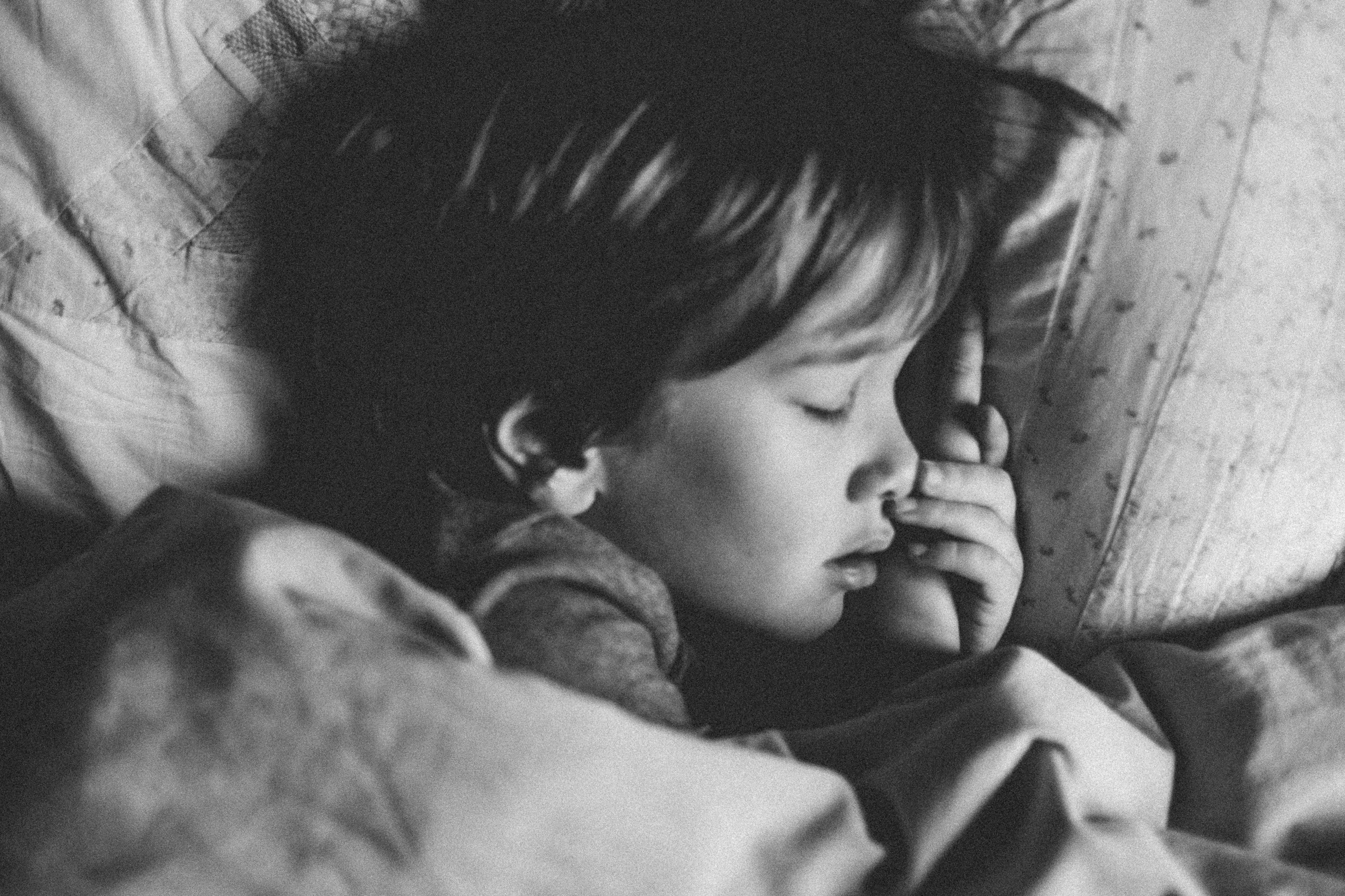 A child sleeping on the bed | Source: Unsplash