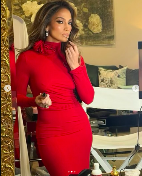 Jennifer Lopez posing in her red dress posted on December 20, 2023 | Source: Instagram/jlo