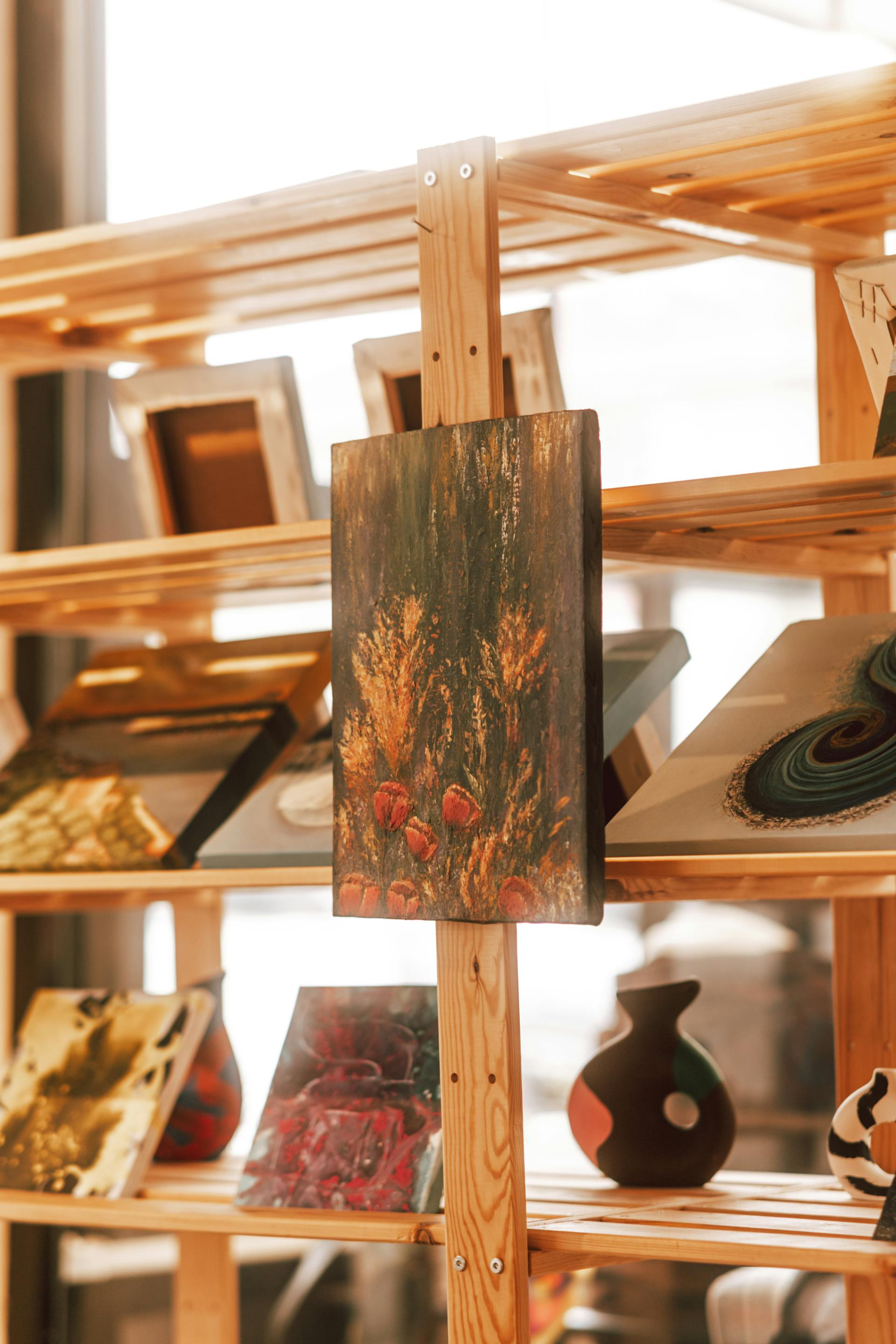 Close-up display of paintings and assorted artwork | Source: Pexels