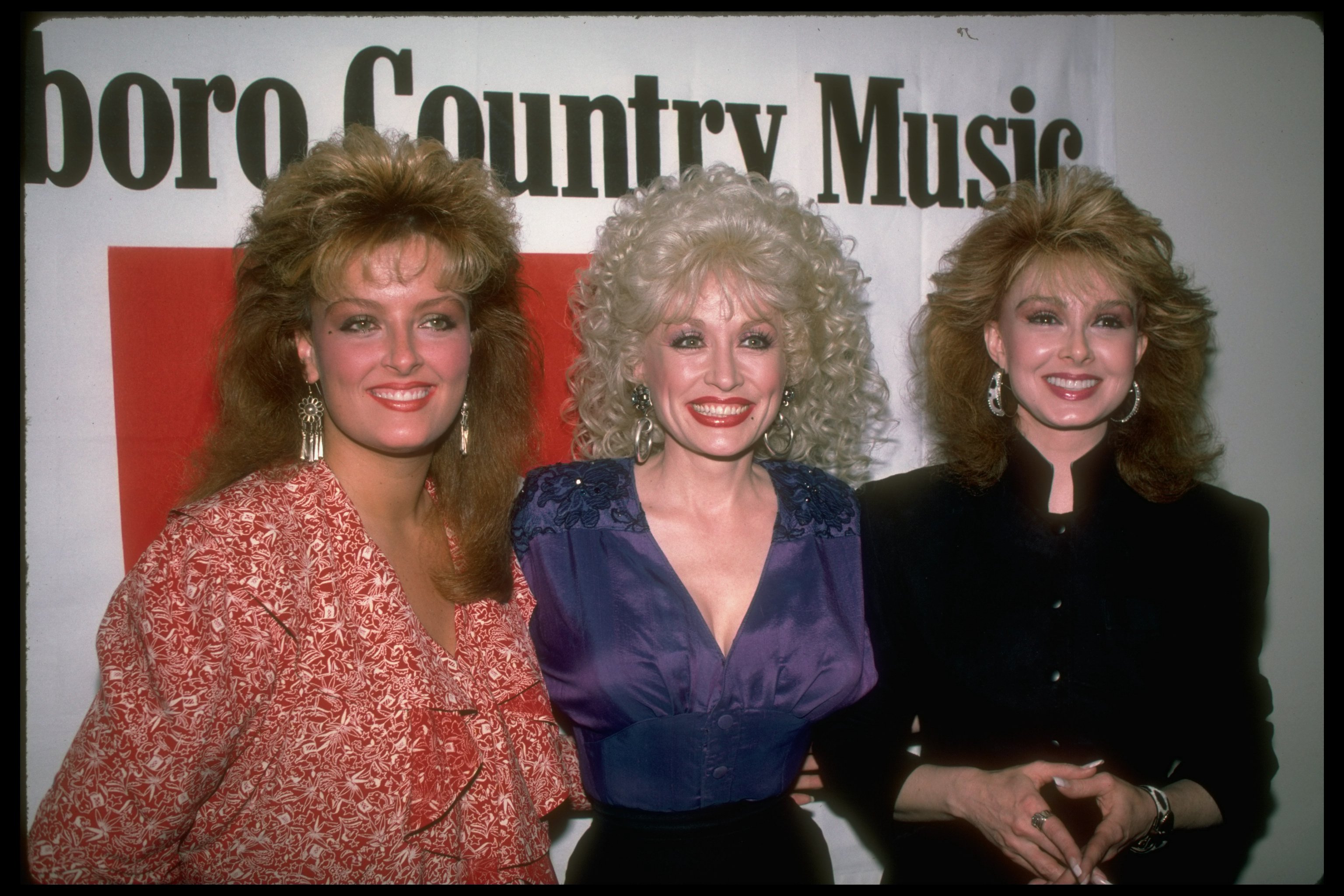 Wynonna Judd, Dolly Parton, and Naomi Judd pose for an image together on March 1, 1987. | Source: Robin Platzer/Getty Images