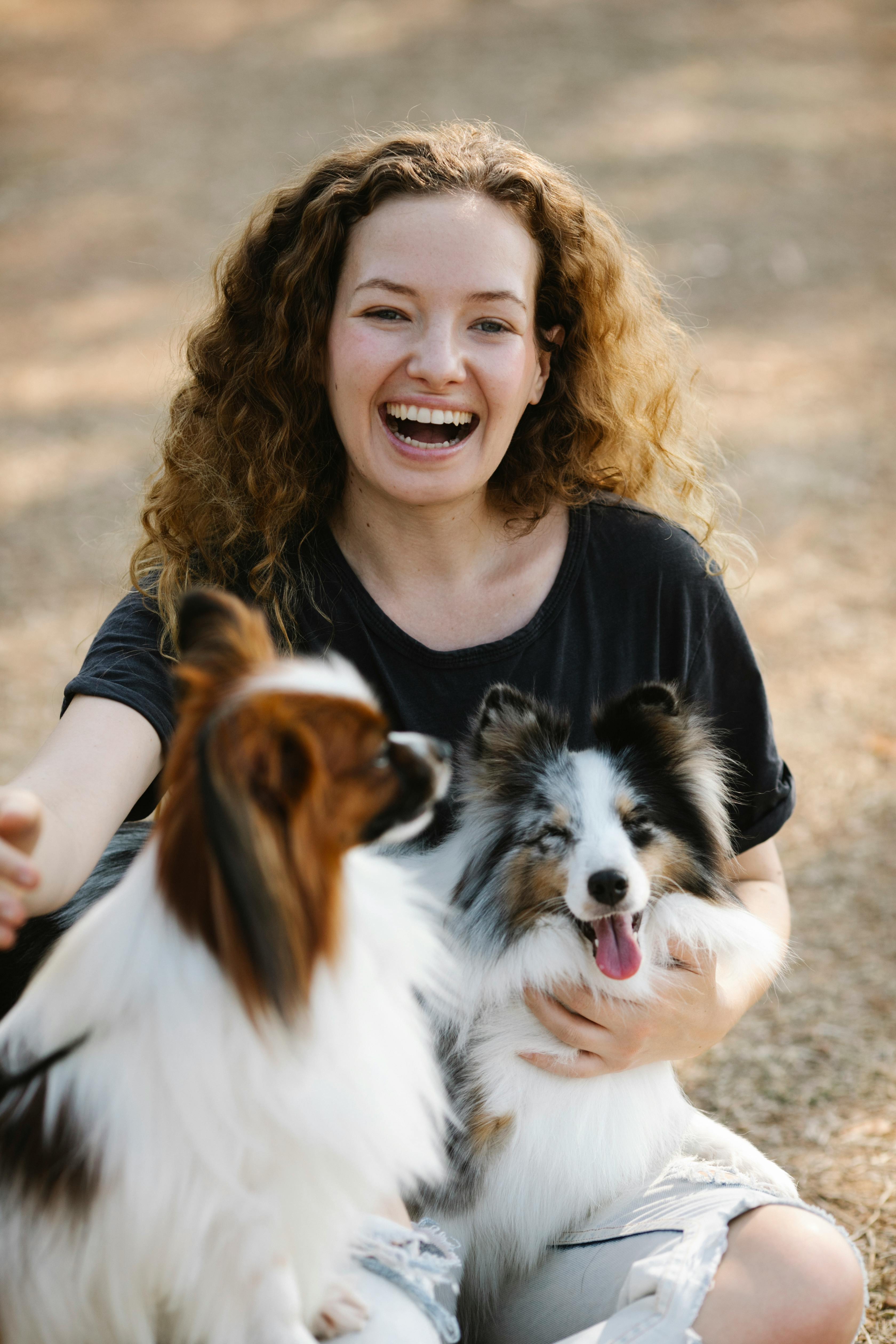 A woman with her dogs | Source: Pexels