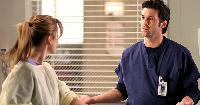 Patrick Dempsey and Ellen Pompeo on the set of "Greys Anatomy", December 2004 | Source:Getty Images