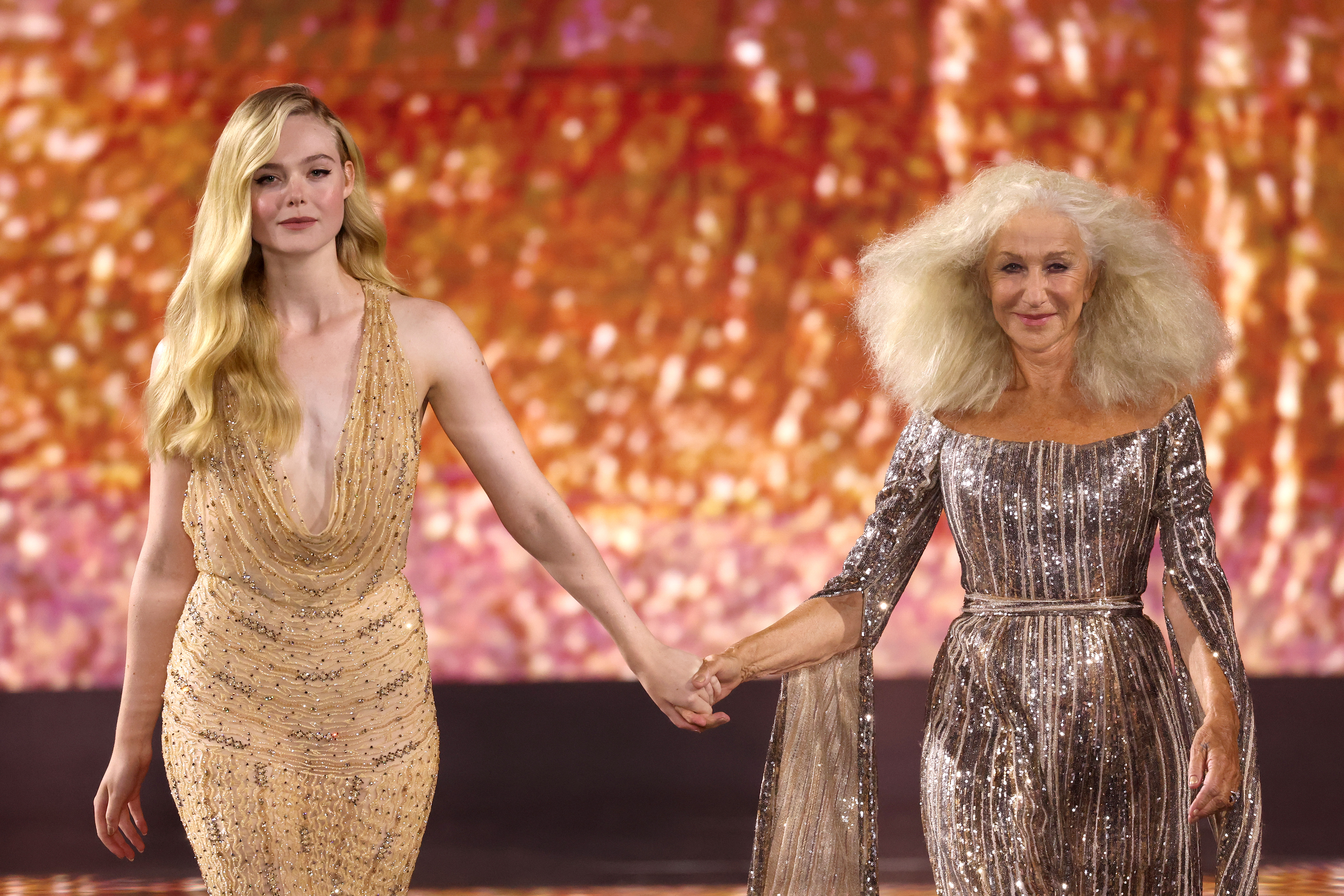 Elle Fanning and Dame Helen Mirren walks the runway during the 6th L'Oreal Show in Paris, France on October 01, 2023 | Source: Getty Images
