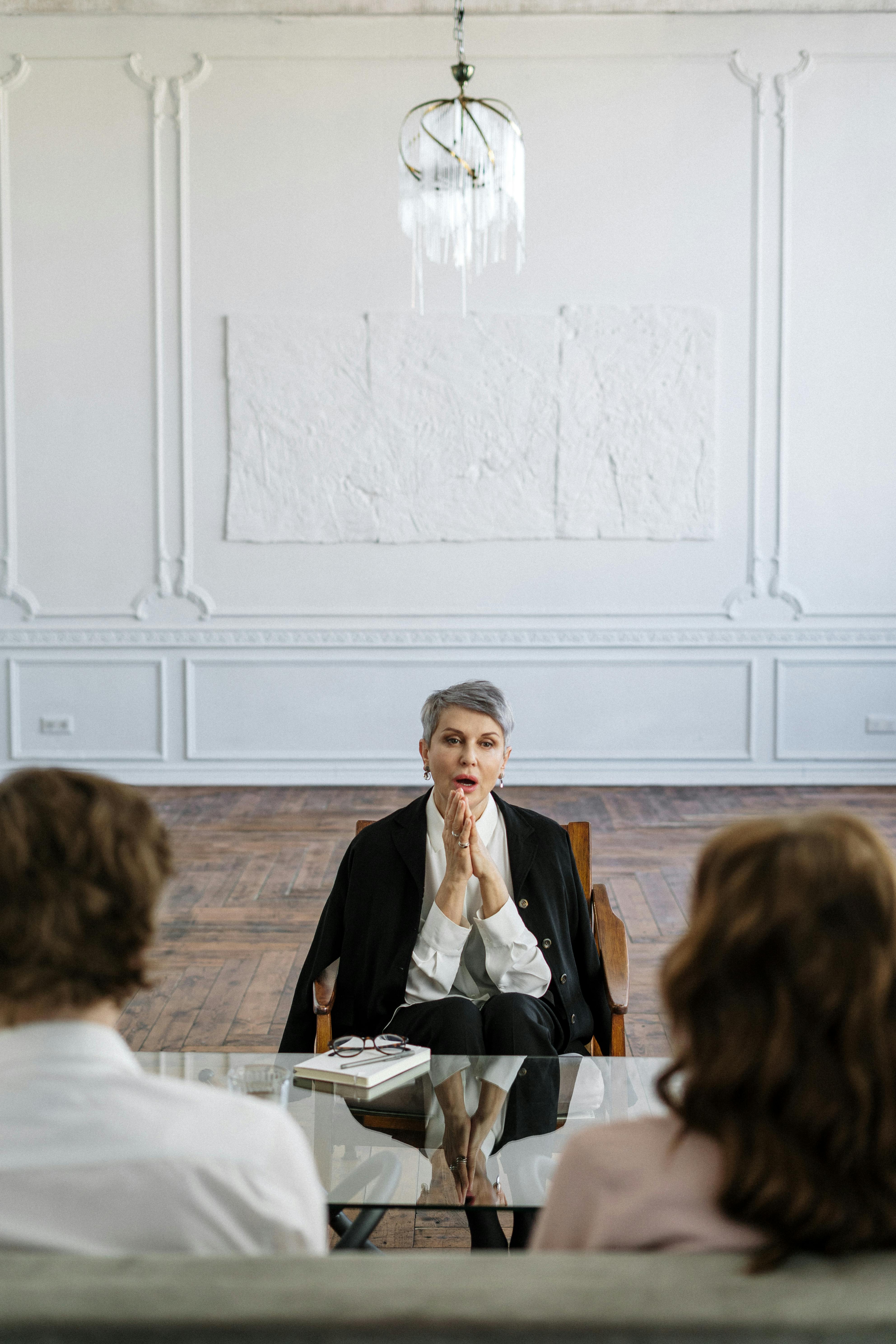 An older woman talking to a young couple | Source: Pexels