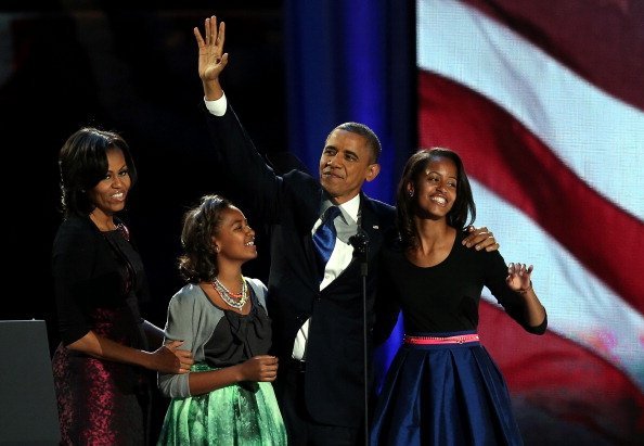 President Barack Obama, Michelle Obama, Sasha, and Malia at McCormick Place November 6, 2012 in Chicago, Illinois | Photo: Getty Images