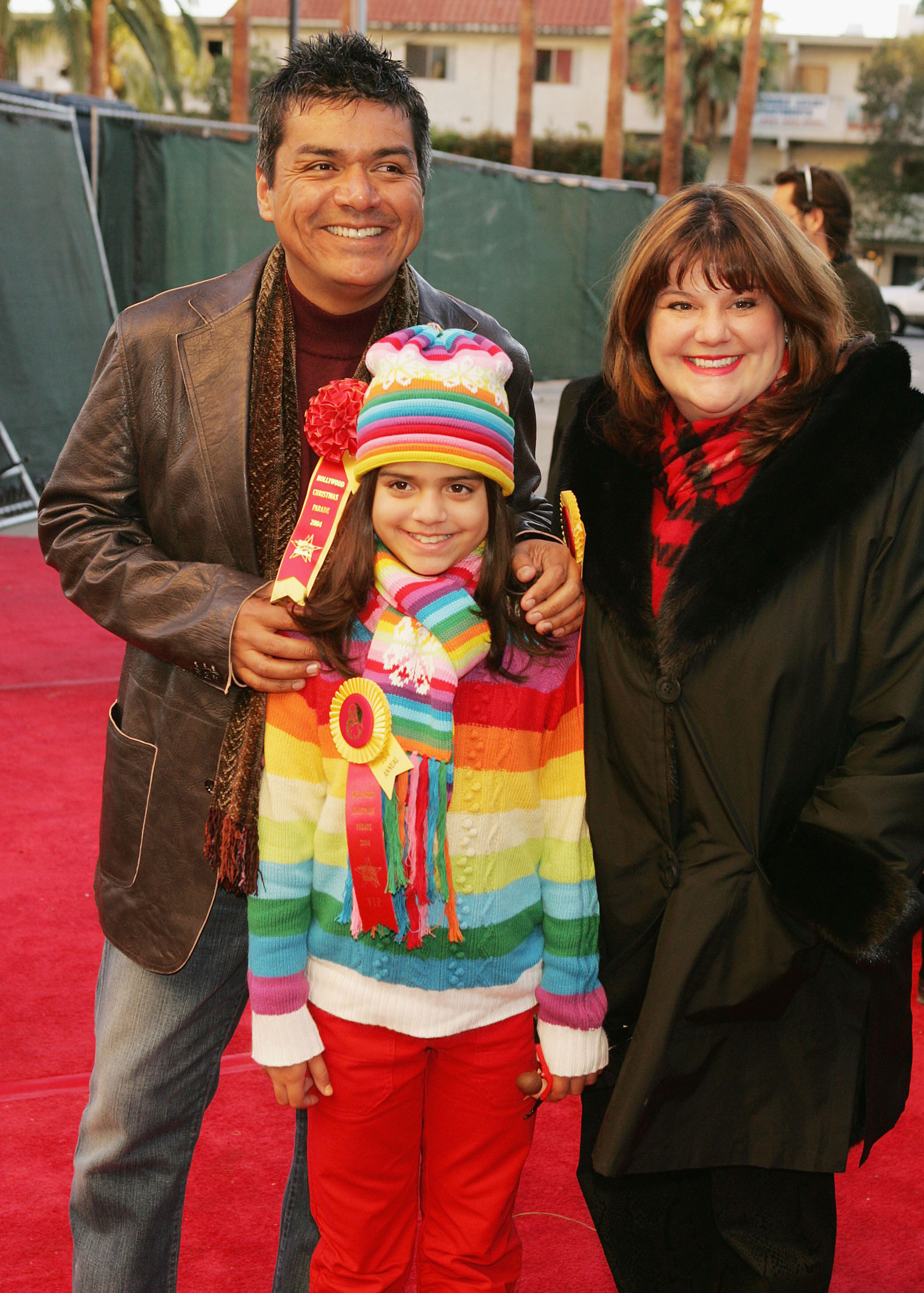 Actor George Lopez (L), his wife Ann and daughter Maya arrive at the 73rd Annual Hollywood Christmas Parade on November 28, 2004 in Hollywood, California. | Source: Getty Images