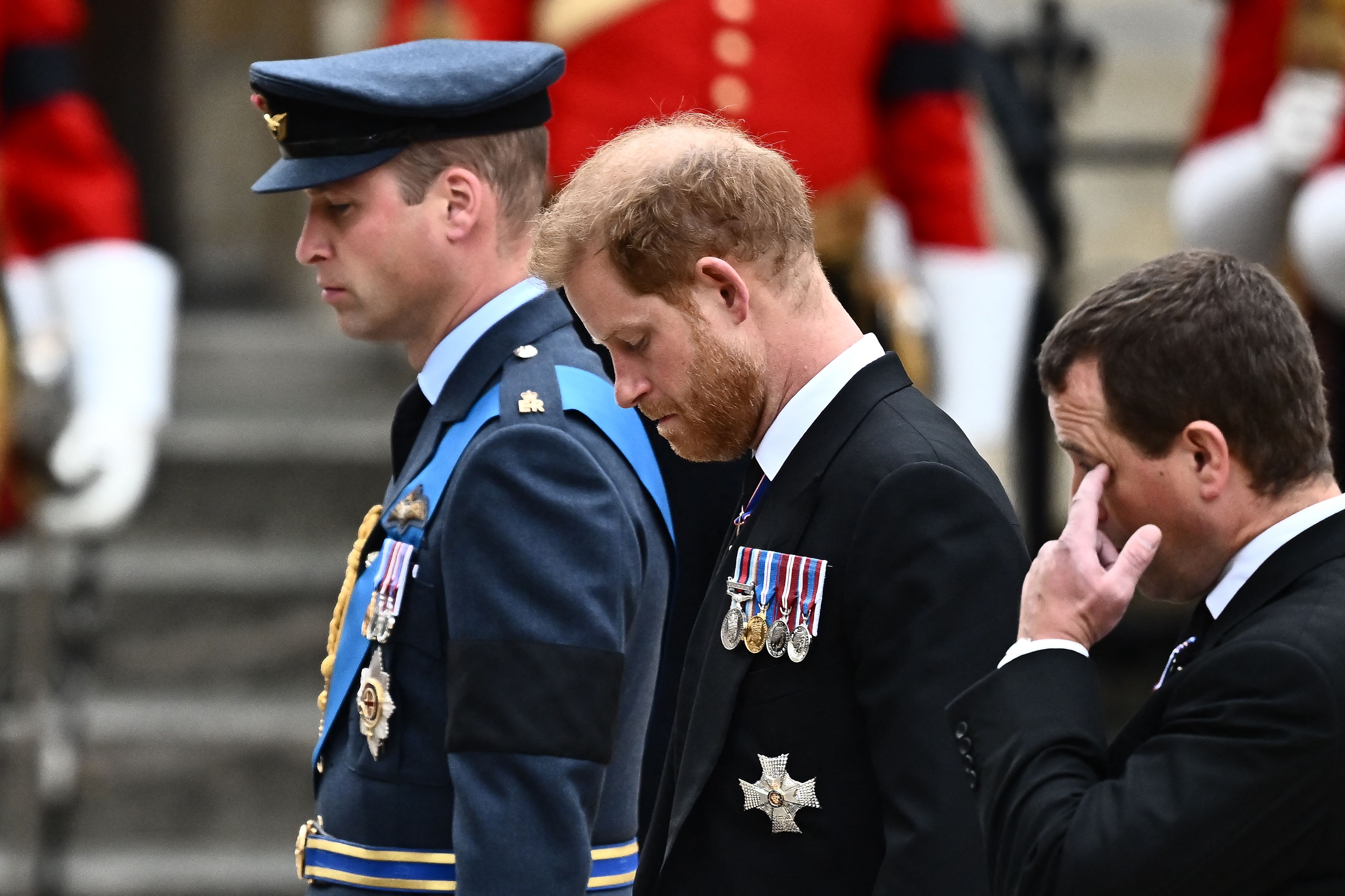 Britain's Prince William, Prince of Wales (L) and Britain's Prince Harry (C), Duke of Sussex arrive at Westminster Abbey in London on September 19, 2022 | Source: Getty Images