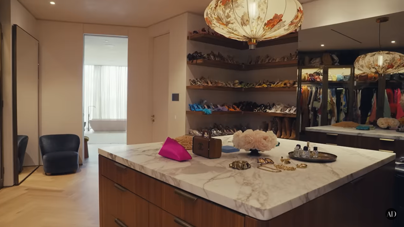 Chrissy Teigen and John Legend's walk-in closet at their Beverly Hills home | Source: YouTube/ArchitecturalDigest