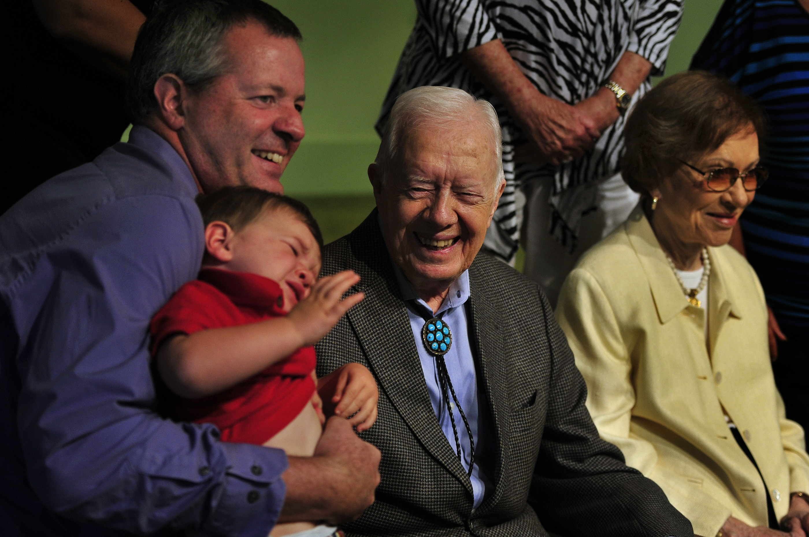 Andy Case-Simonson, Lennon Case-Simonson, and Jimmy and Rosalynn Carter in Plains, Georgia, on August 30, 2015. | Source: Getty Images