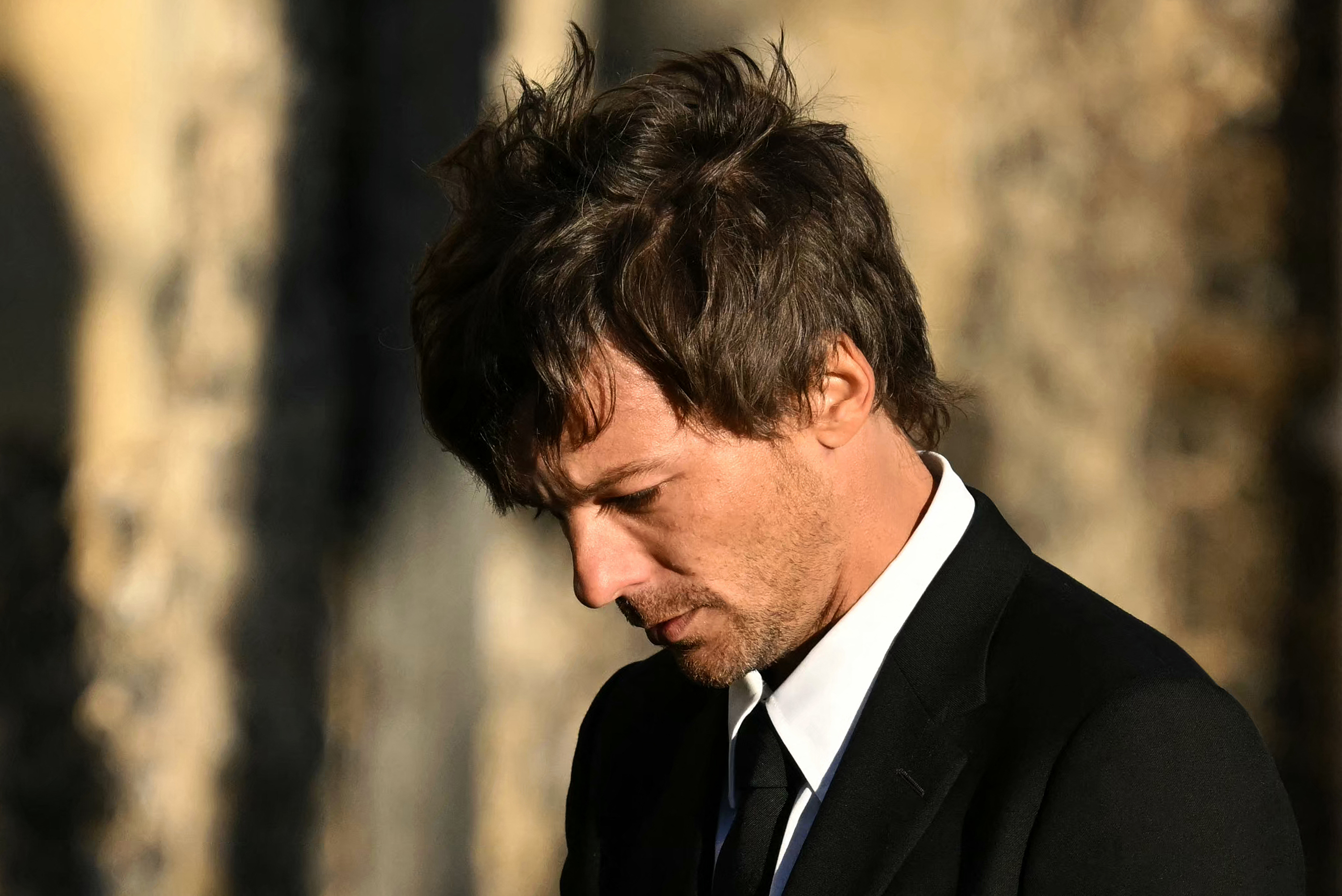 Louis Tomlinson leaves Liam Payne's funeral at St. Mary's Church in Amersham, London, on November 20, 2024 | Source: Getty Images