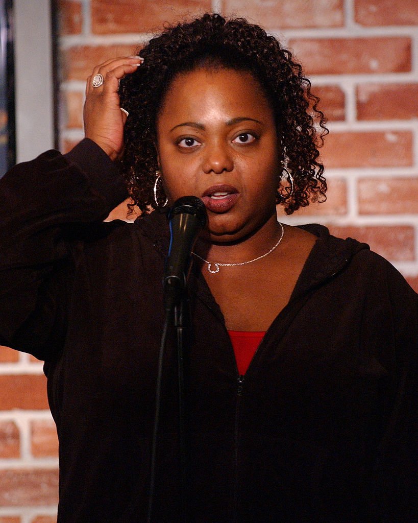Cocoa Brown stands in front of a mic during her comedic performance at the Ha Ha Cafe on March 21, 2007, in Hollywood, California | Source: Getty Images (Photo by Michael Schwartz/WireImage)