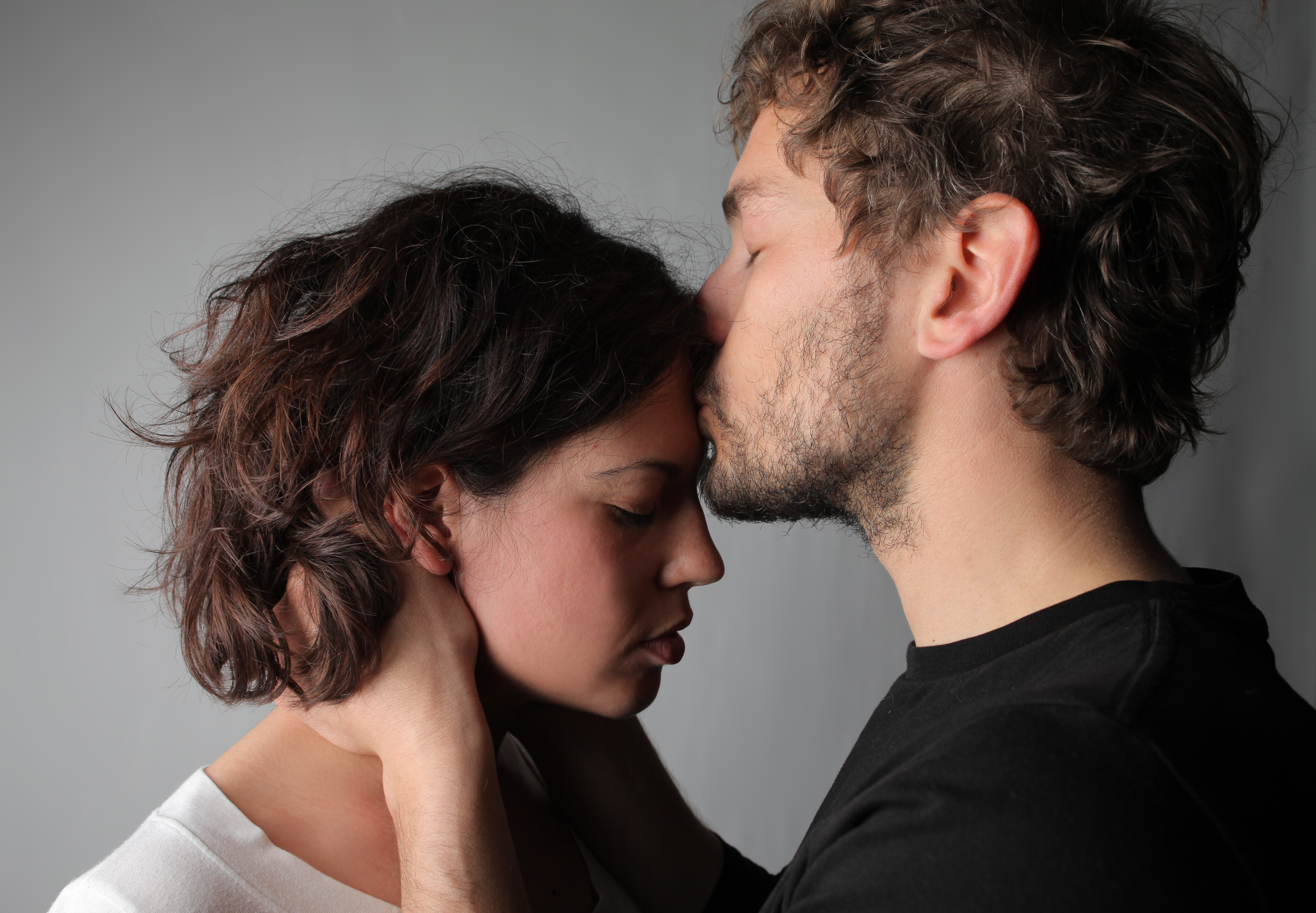 Boyfriend comforts young female | Source: Shutterstock