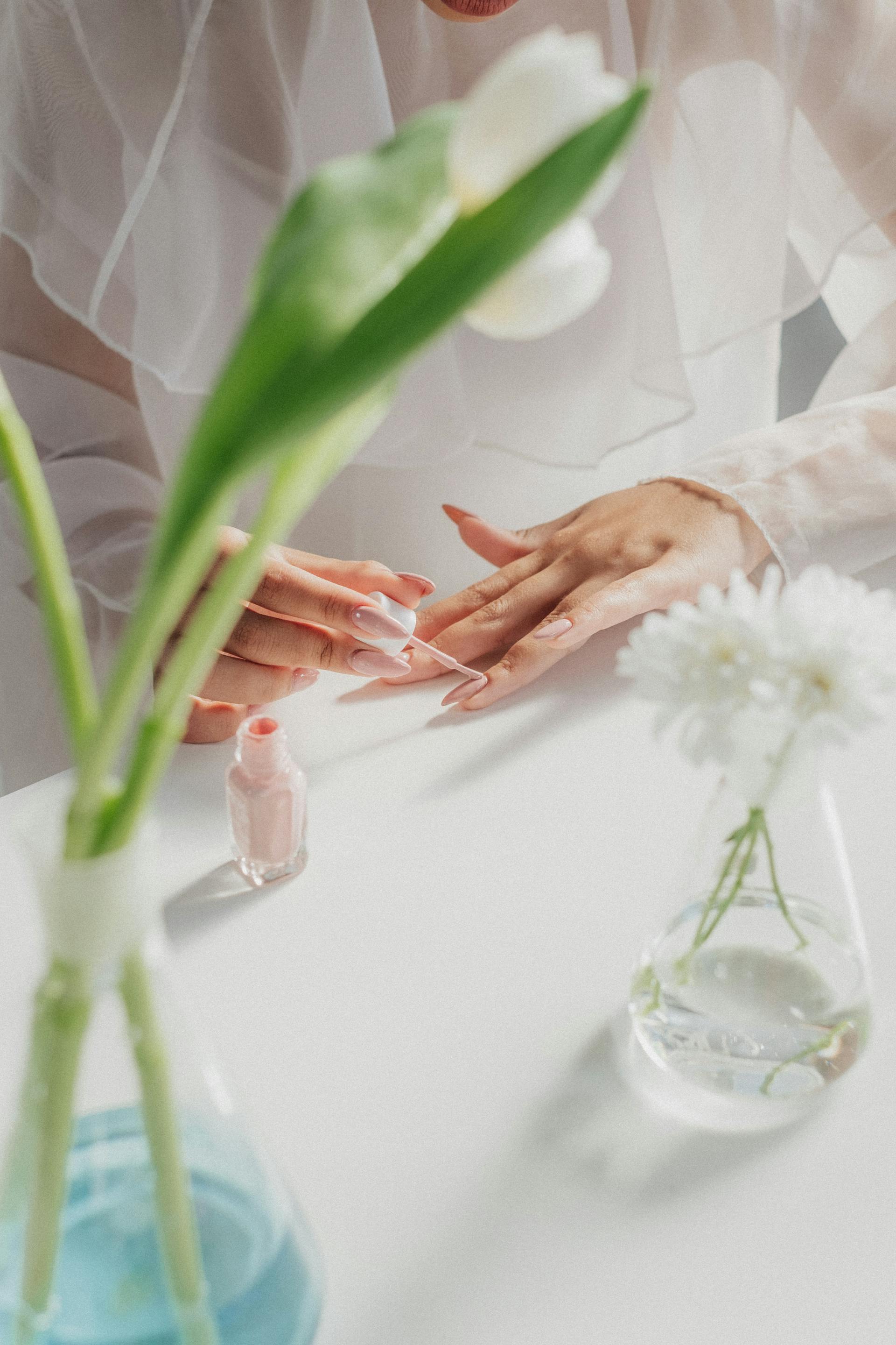 A woman painting her nails | Source: Pexels