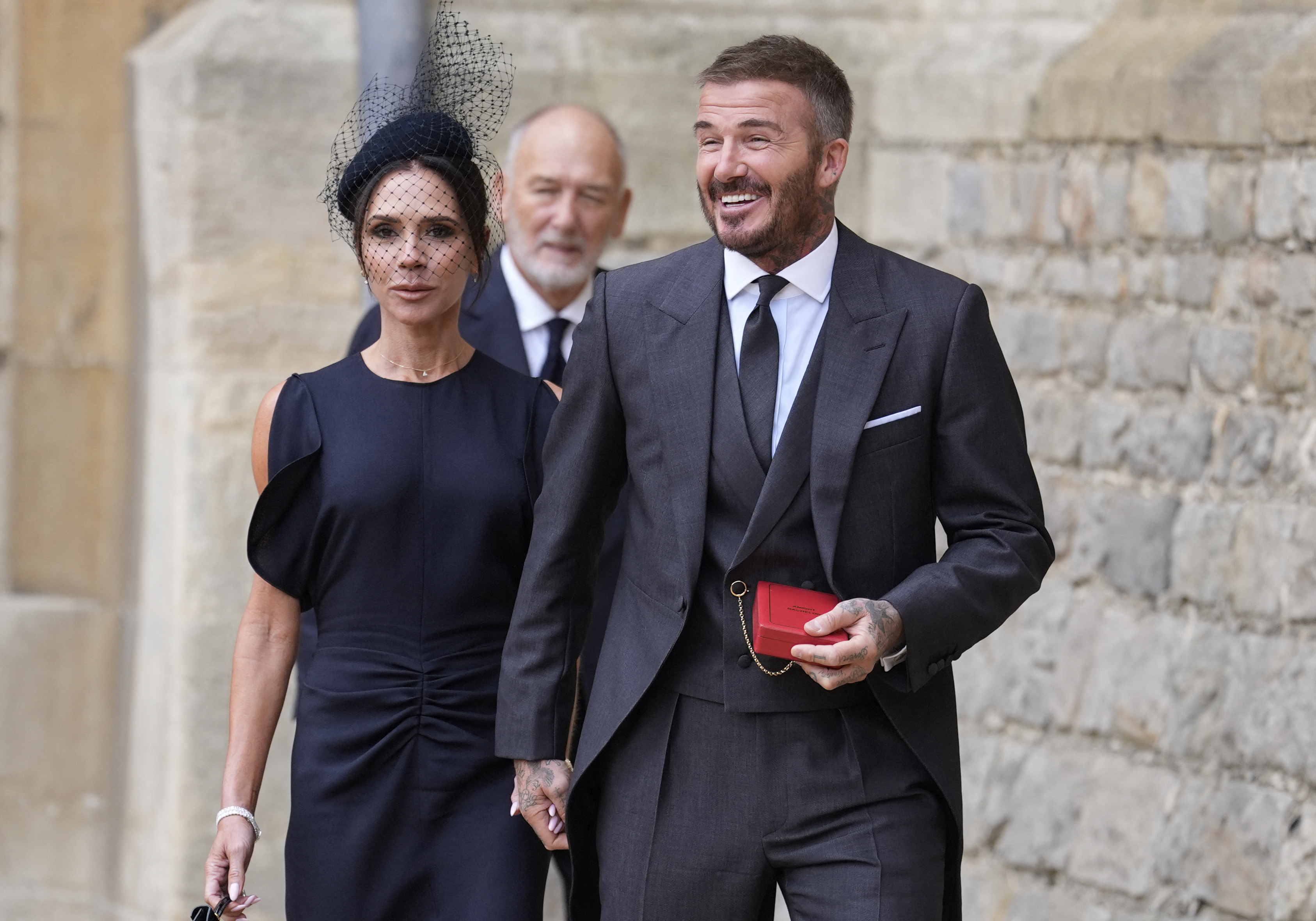 Lady Victoria Beckham, Sir David Beckham, and Ted Beckham at Windsor Castle for David's knighting by the King of England in Windsor, England on November 4, 2025. | Source: Getty Images