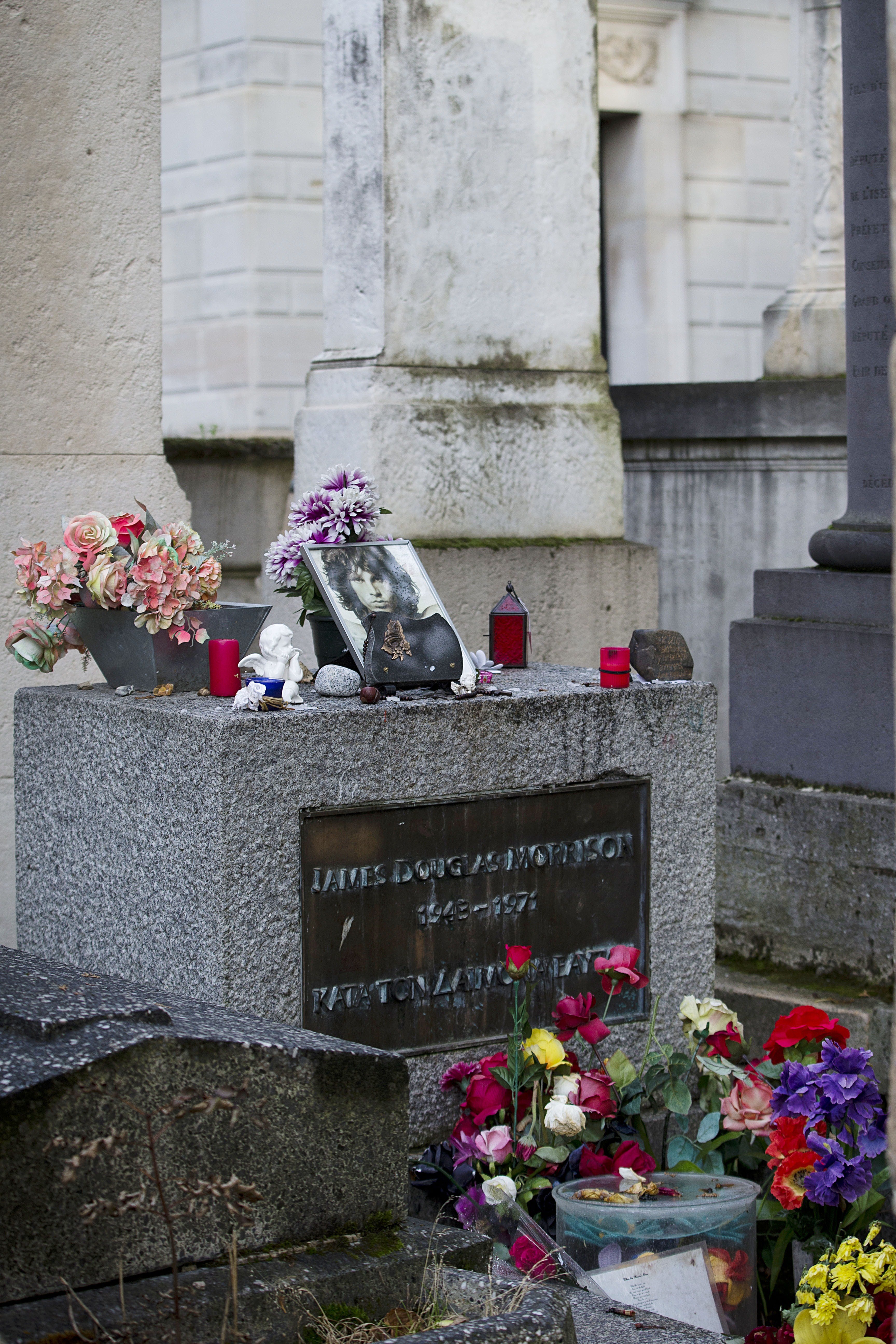 A picture shows the grave of US singer Jim Morrison at the Pere-Lachaise cemetery in Paris on October 16, 2014 in Paris. | Source: Getty Images