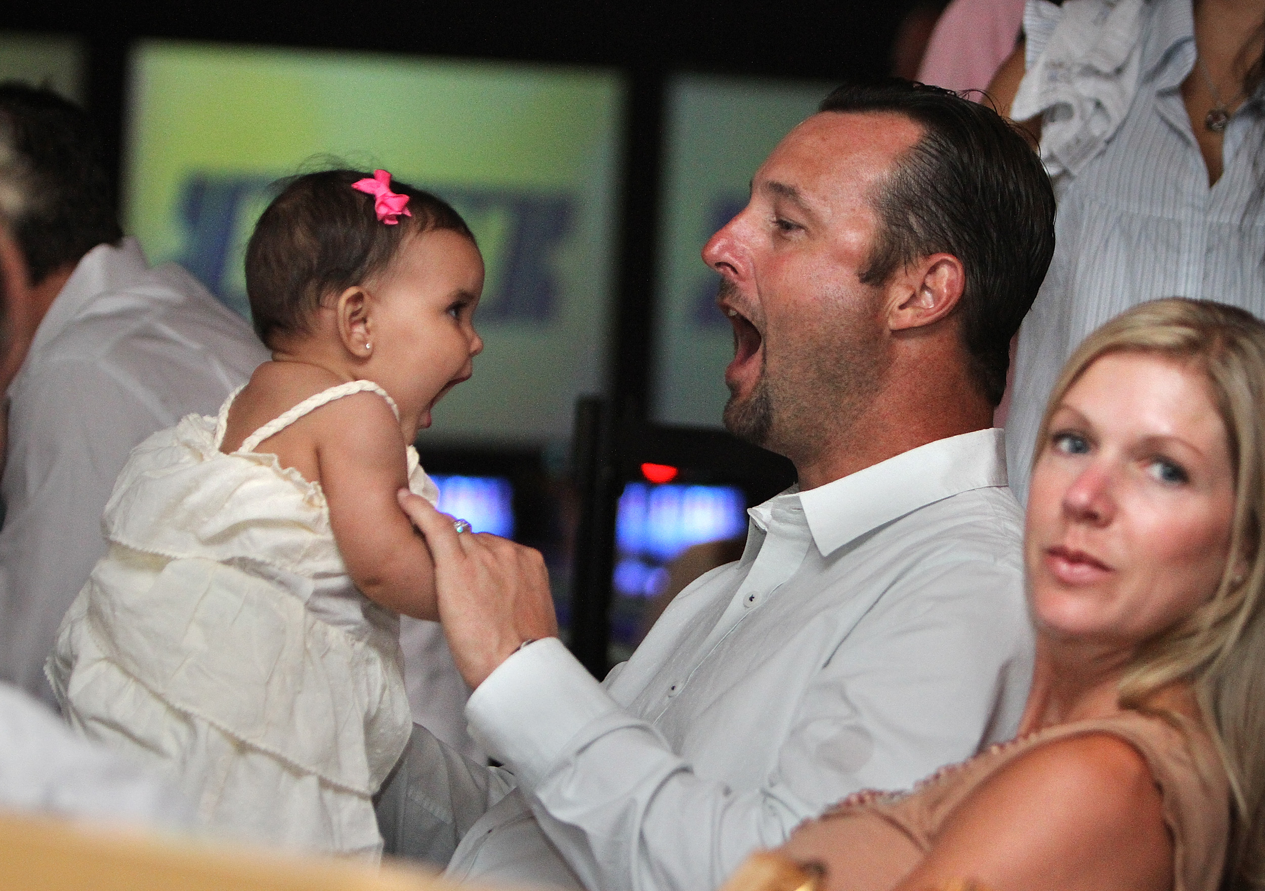 Tim and Stacy Wakefield with Manny Delcarmen's daughter Miley at Manny's Bowling Strikes for Schools event in Boston, Massachusetts on June 28, 2010 | Source: Getty Images