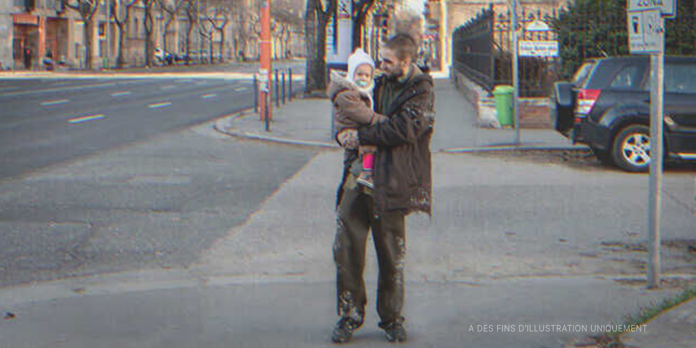 Un sans-abri portant un bébé | Photo : Flickr / Simóca & Annus (Public Domain)
