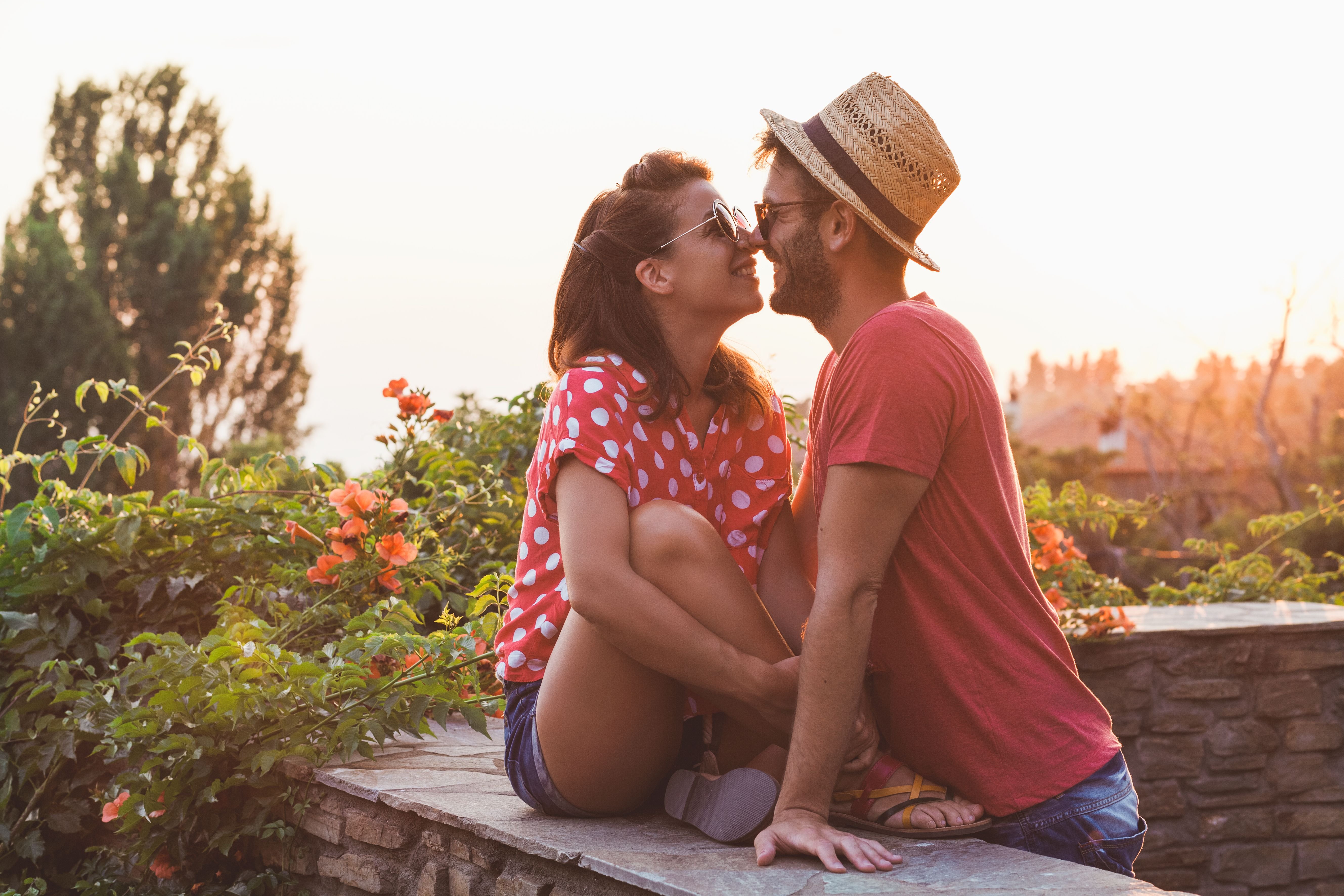 A couple look sweetly at each other during golden hour. | Source: Shutterstock