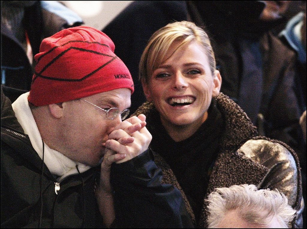 Prince Albert of Monaco with his new girlfriend Charlene Wittstock during the opening ceremony of the 2006 Winter Olympics in Turin.  |  Photo: Getty Images