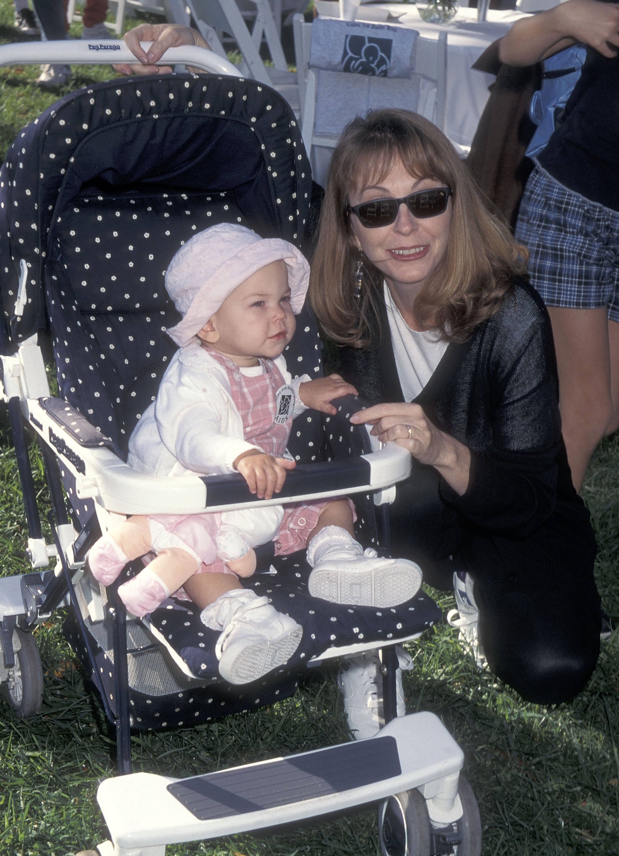 Cassandra Peterson and daughter Sadie Pierson at the Caring for Babies with AIDS' Fifth Annual Stroll-A-Thon oin 1995 at Roxbury Memorial Park in Beverly Hills, California. | Source: Getty Images