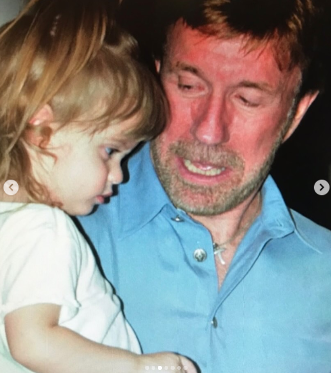 Chuck Norris holds a young Danilee in a close father-daughter moment, as posted on March 19, 2026 | Source: Instagram/d.ani.lee