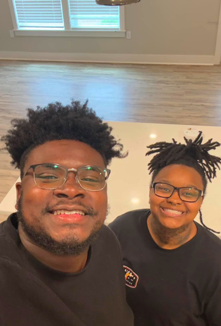 Marquay and Khris Collins beaming for the camera, posted on November 26, 2025. | Source: Facebook/Khris Collins