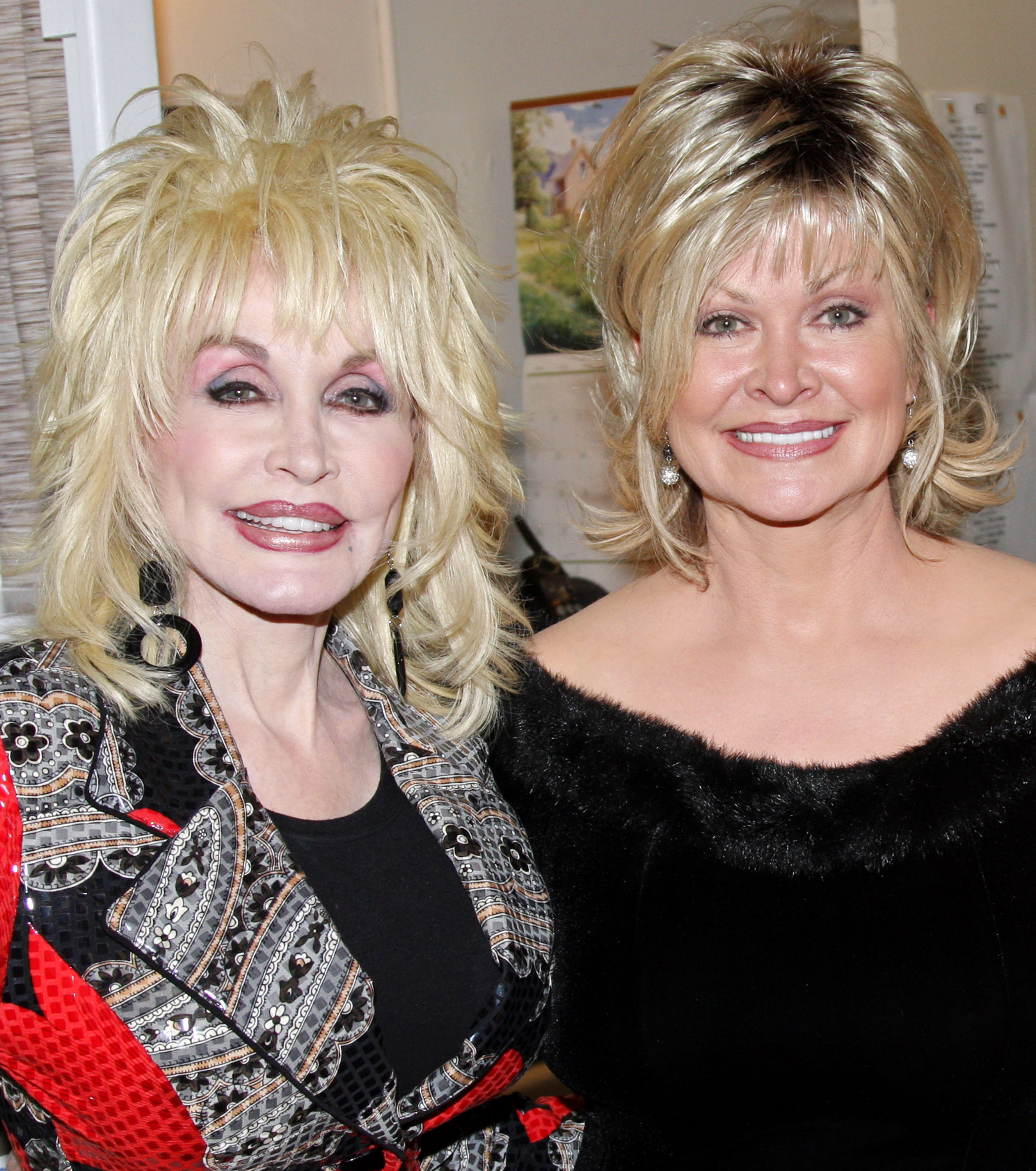 Dolly Parton and her sister Rachel Parton Dennison (the film and tv series "Doralee's") pose backstage at the hit new musical "9 to 5" on Broadway at The Marquis Theatre on April 13, 2009, in New York City. | Source: Getty Images