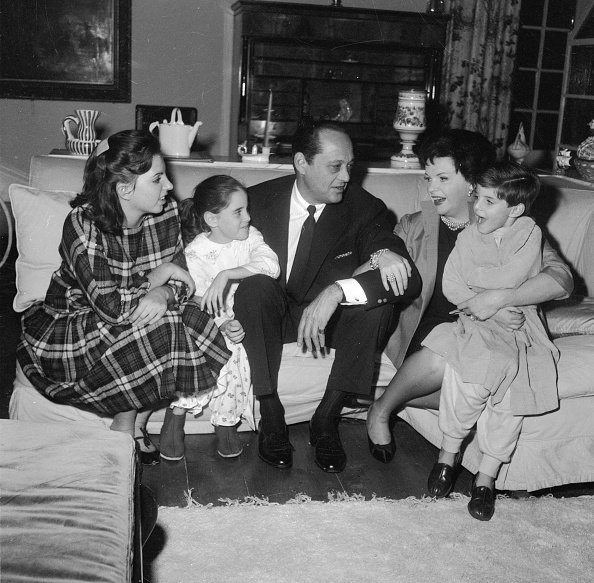 American film star, Judy Garland (1922 - 1969) with her husband, Sid Luft and their children, Liza (14), Lorna (7) and Joe (5) at their home in Chelsea, London | Photo: Getty Images