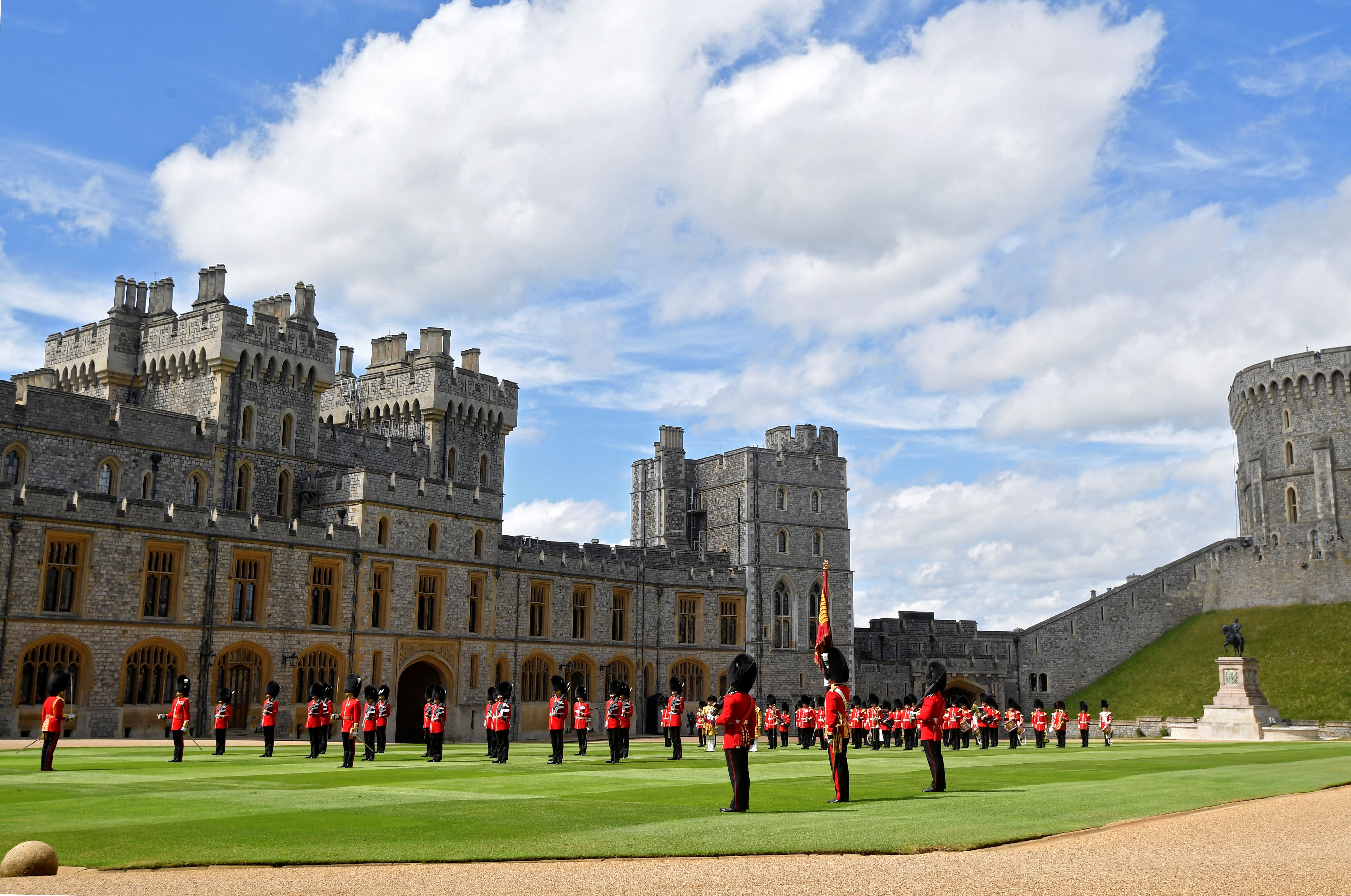 Guardsmen keeping social distance as they stand in formation during Trooping the Colour at Windsor Castle in Windsor, England | Photo: Toby Melville - WPA Pool/Getty Images