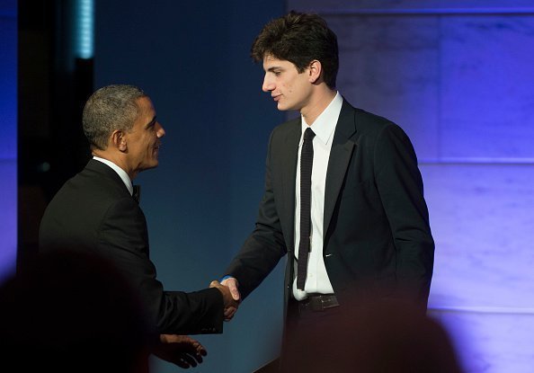 Former President Barack Obama shakes hands with Jack Schlossberg at the Smithsonian National Museum of American History on November 20, 2013 in Washington | Source: Getty images