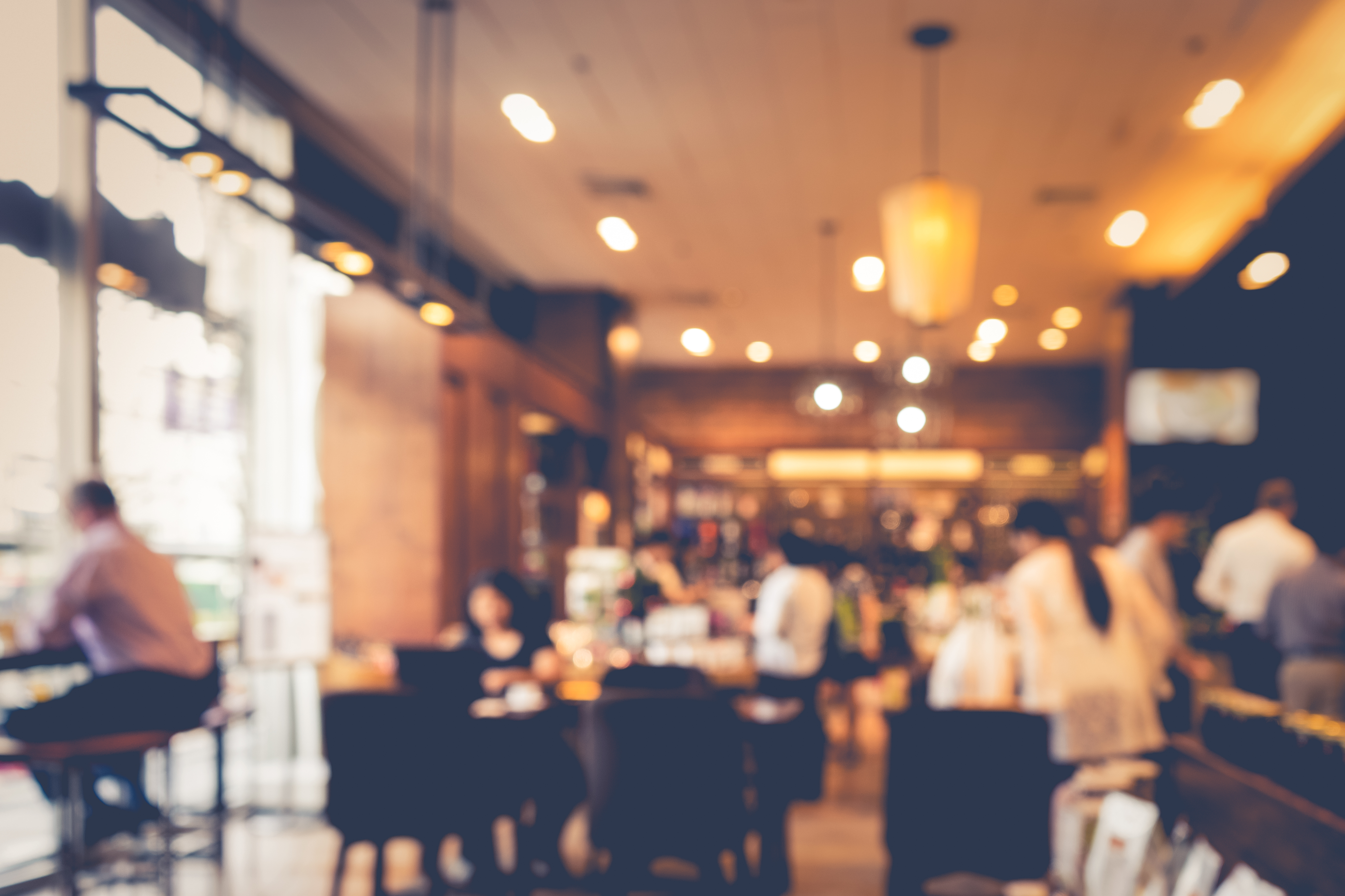 Blur coffee shop or cafe restaurant with abstract bokeh light image background. | Source: Shutterstockd.