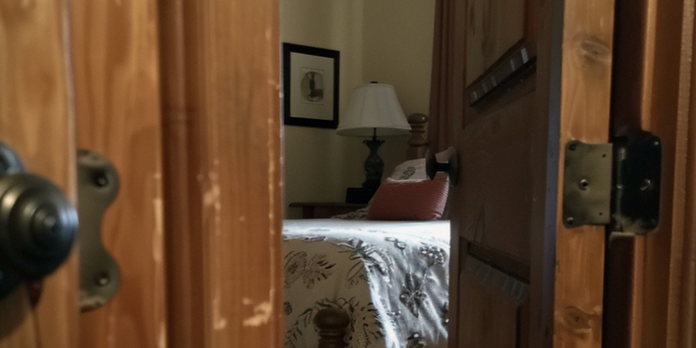A door opening to a bedroom | Source: Midjourney