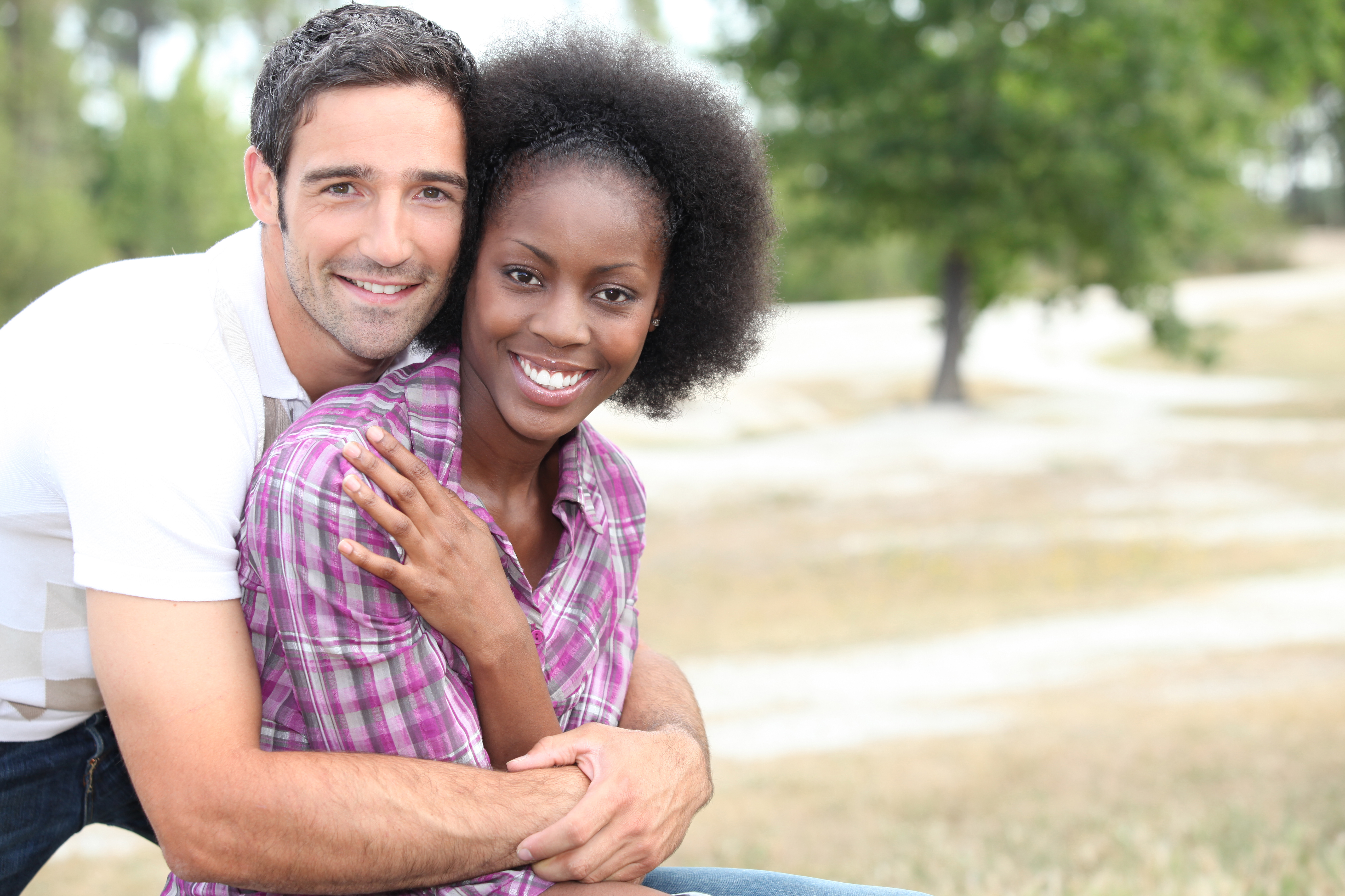 A mixed-race couple outdoors | Source: Shutterstock