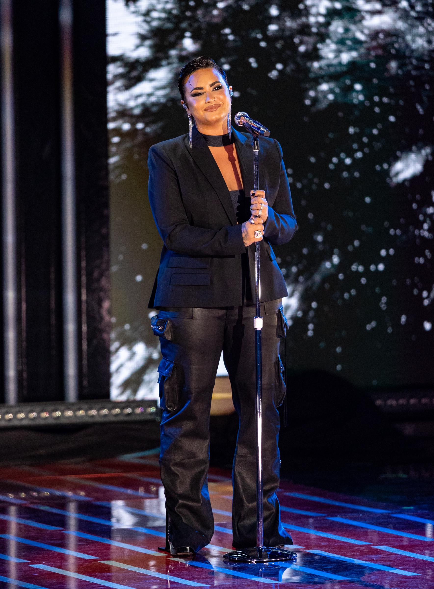 Demi Lovato performs onstage at Global Citizen Live at the Greek Theatre in Los Angeles, California, on September 25, 2021, showcasing a fuller figure and confident stage presence during a period that preceded her recent, much-discussed physical transformation.