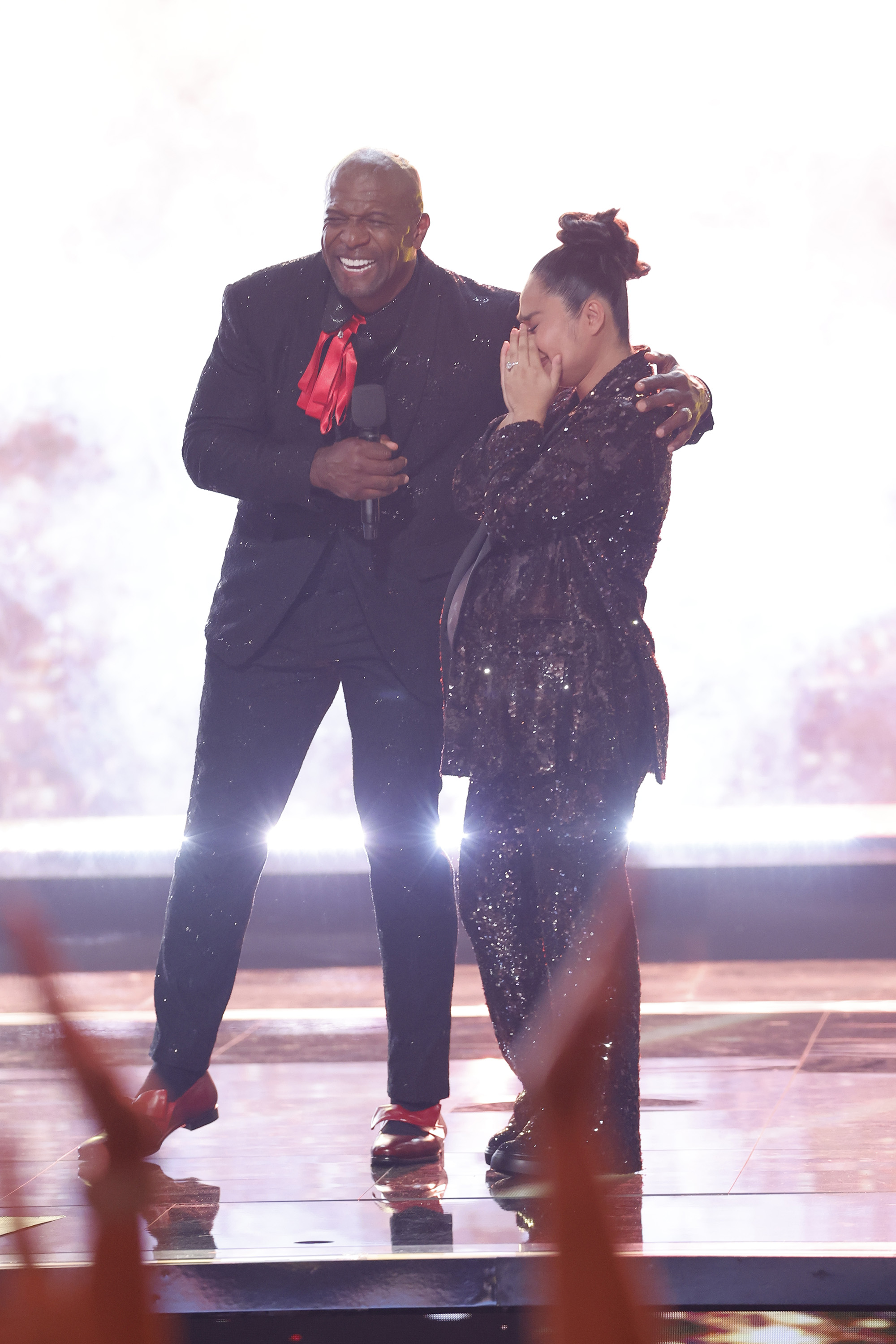 Terry Crews congratulates Jessica Sanchez after announcing her as the winner of Season 20 during the "America's Got Talent" finale in Los Angeles on September 24, 2025 | Source: Getty Images