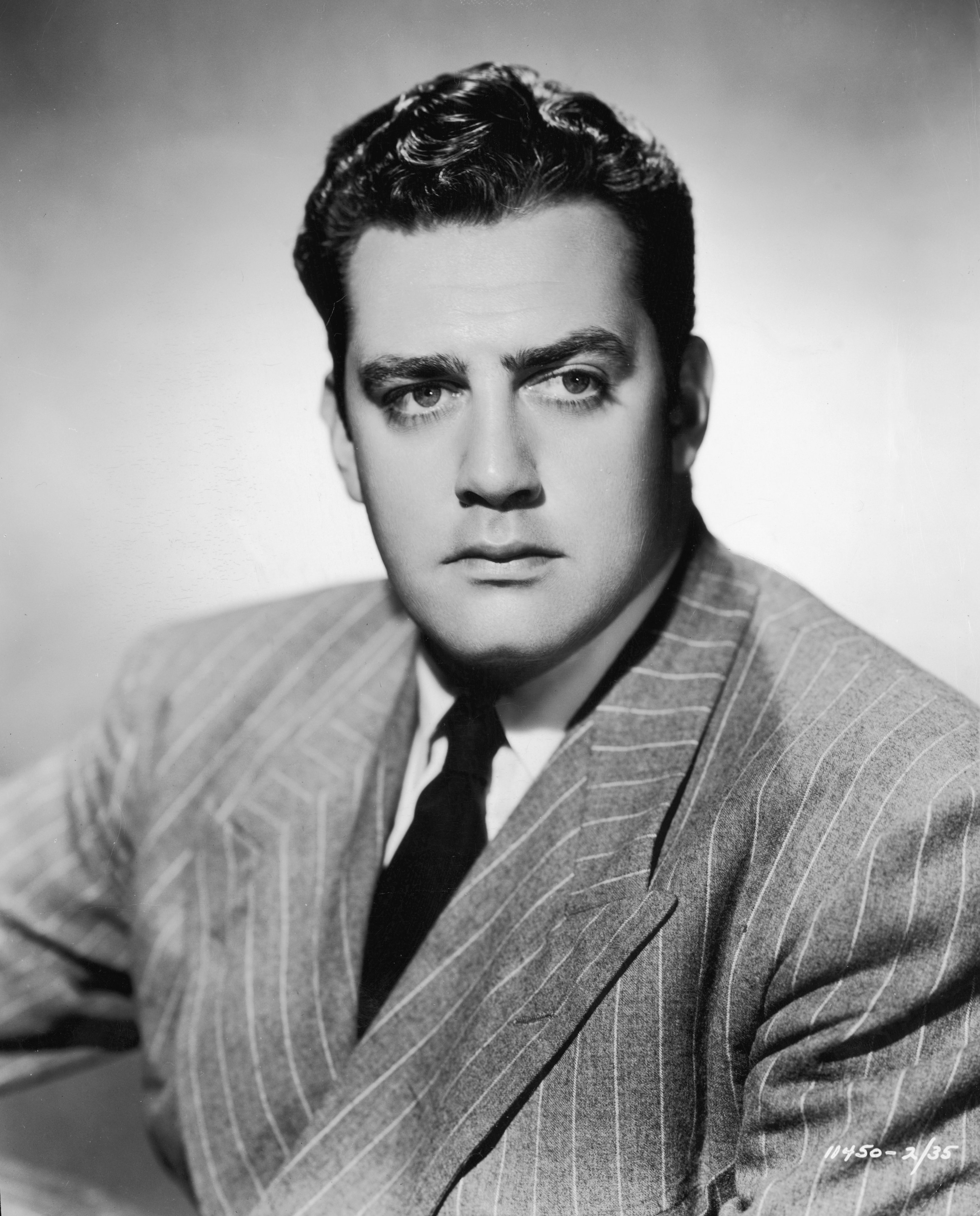 Raymond Burr photographed wearing a pinstriped suit in a promotional headshot for the movie, "Bride of Vengeance" on January 1, 1948 ┃Source: Getty Images