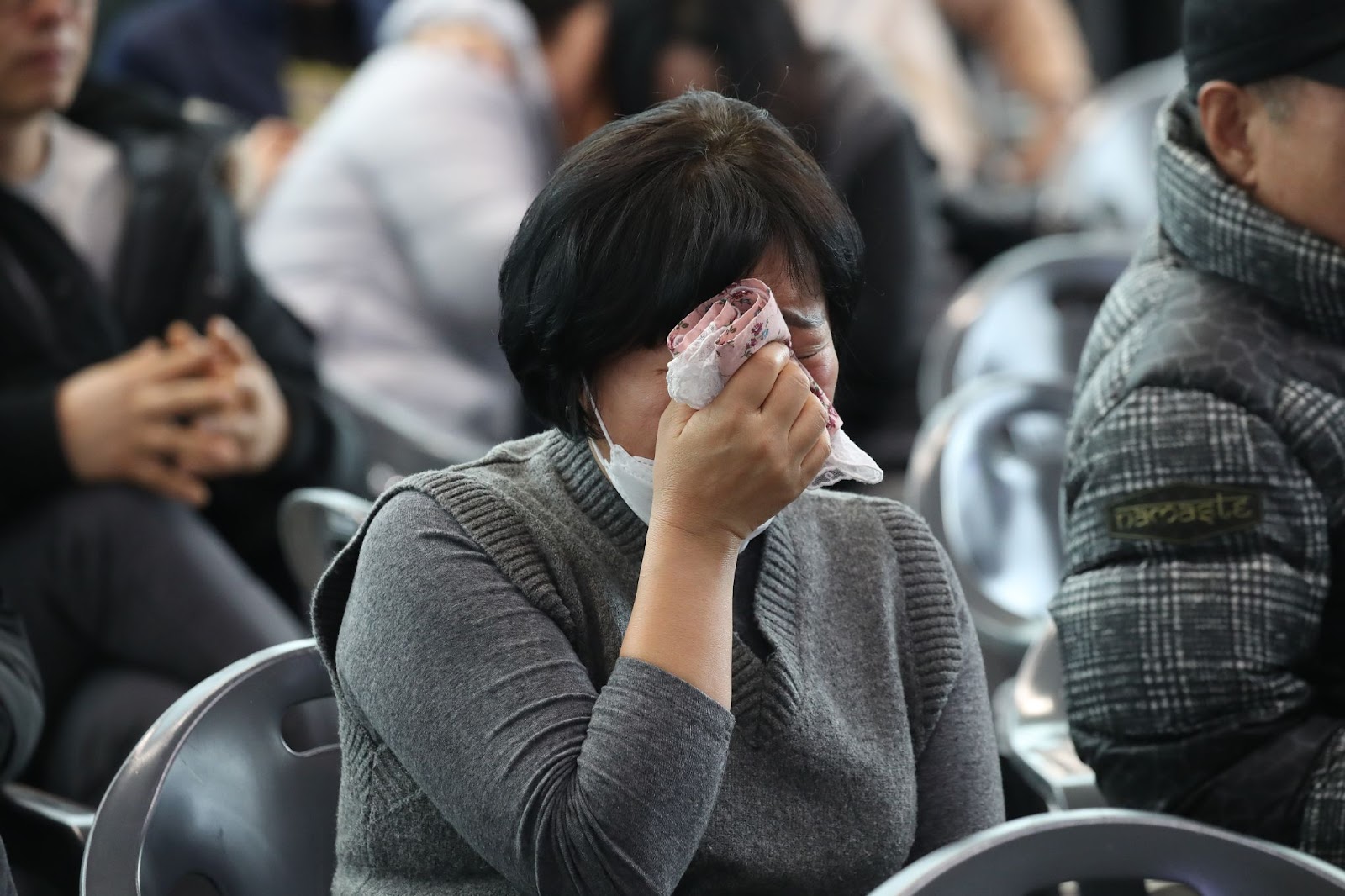 A grieving loved one of a passenger on the Jeju Air Flight 7C2216 at Muan International Airport on December 30, 2024, in Muan-gun, South Korea. | Source: Getty Images