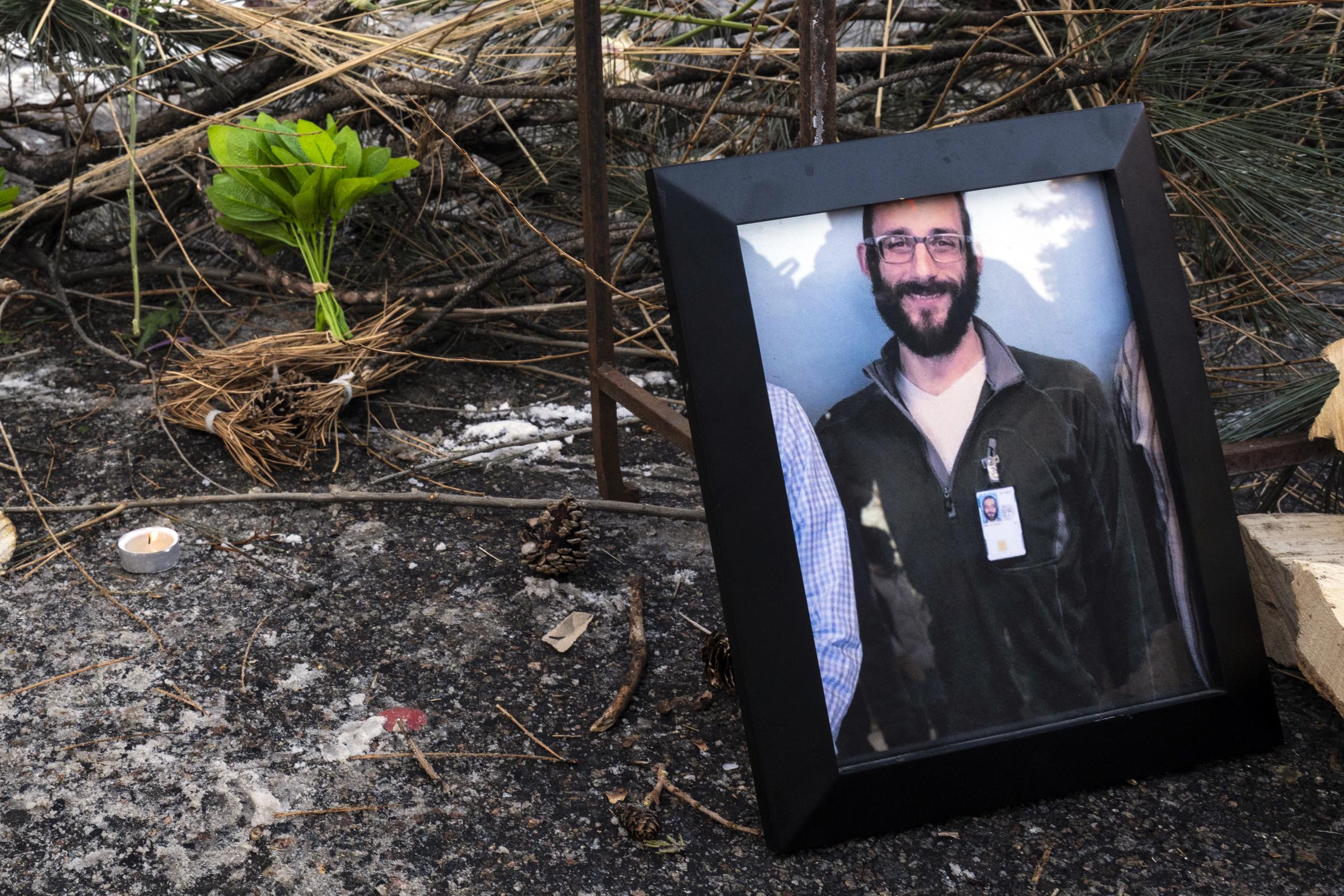 A photograph of Alex Pretti at a makeshift memorial in the area where he was shot dead by federal immigration agents earlier in the day in Minneapolis, Minnesota, on January 24, 2026. | Source: Getty Images