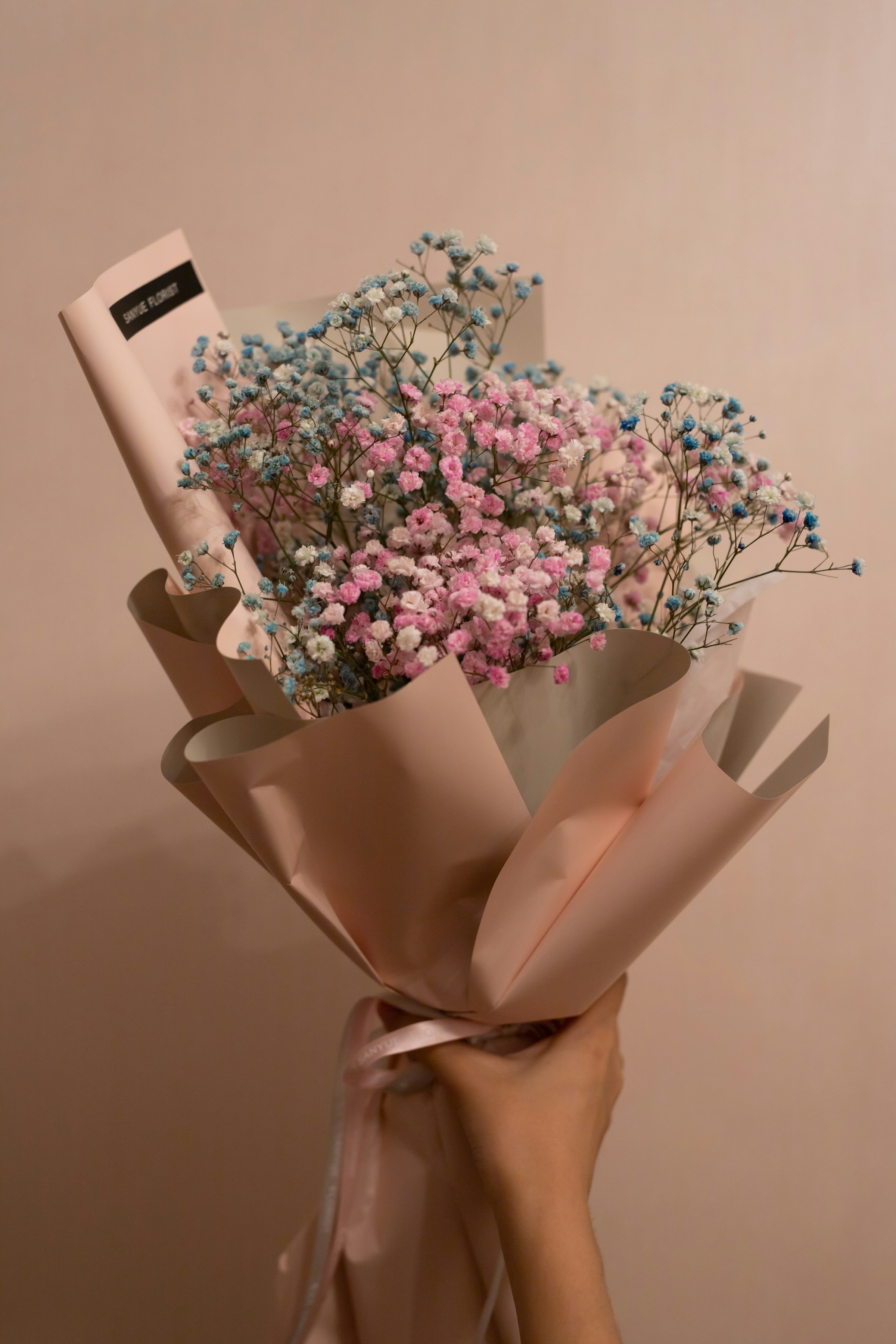 A person holding a bouquet of flowers | Source: Unsplash