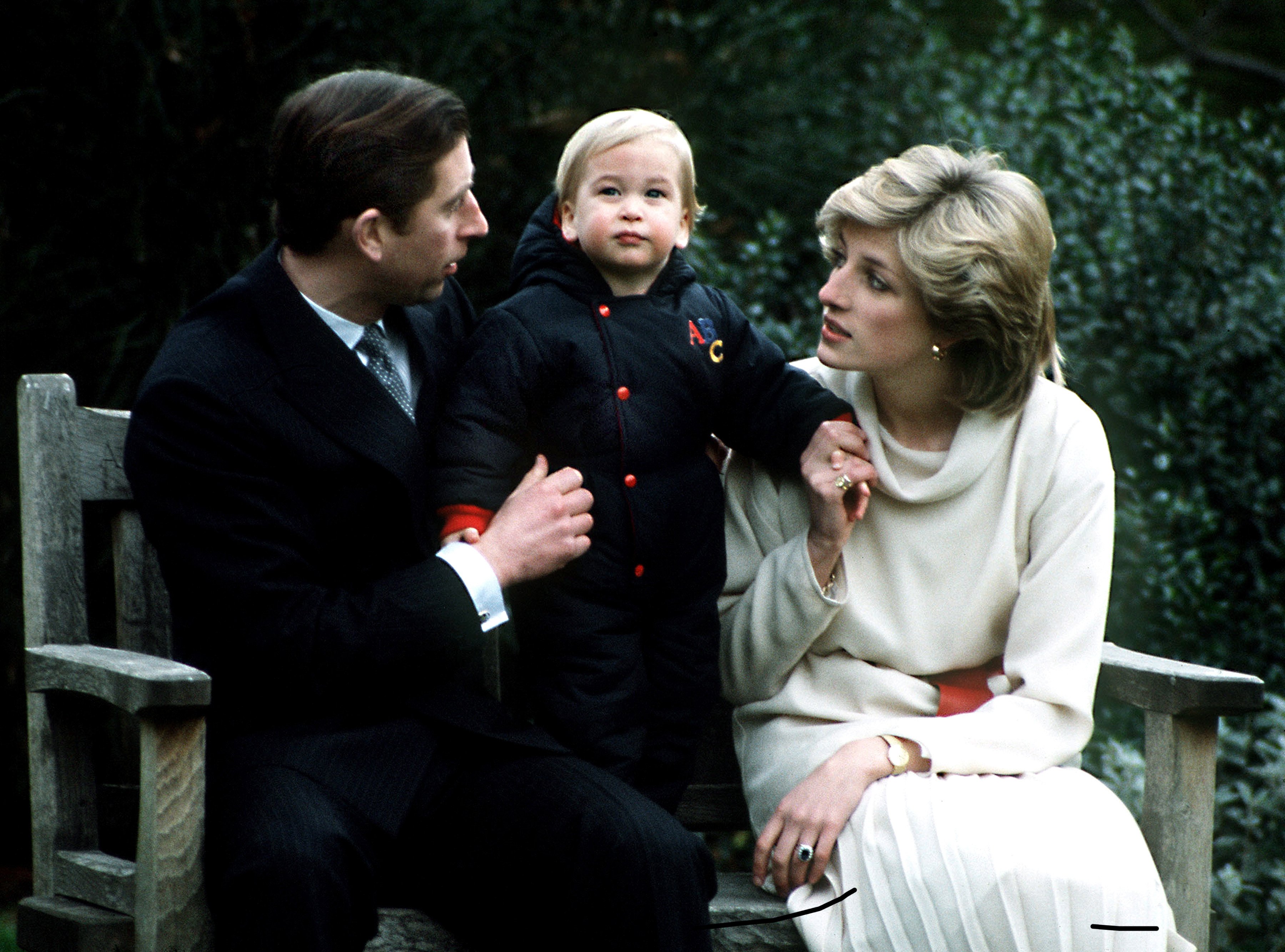 Prince Charles and Princess Diana with their son Prince William at his first official photo-call in the garden on December 14, 1983 at Kensington Palace, London. / Source: Getty Images