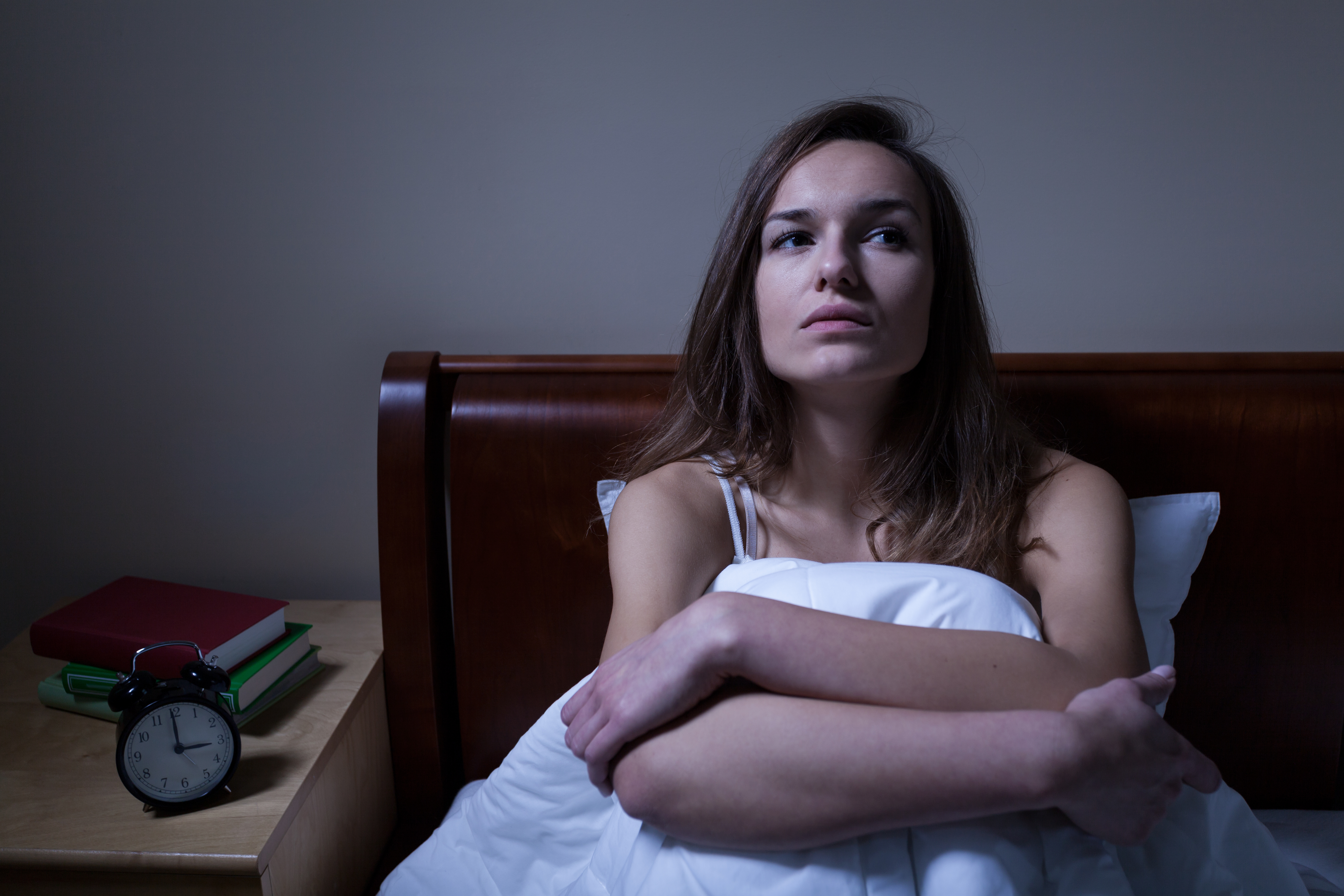 A woman thinking at night  Source: Shutterstock