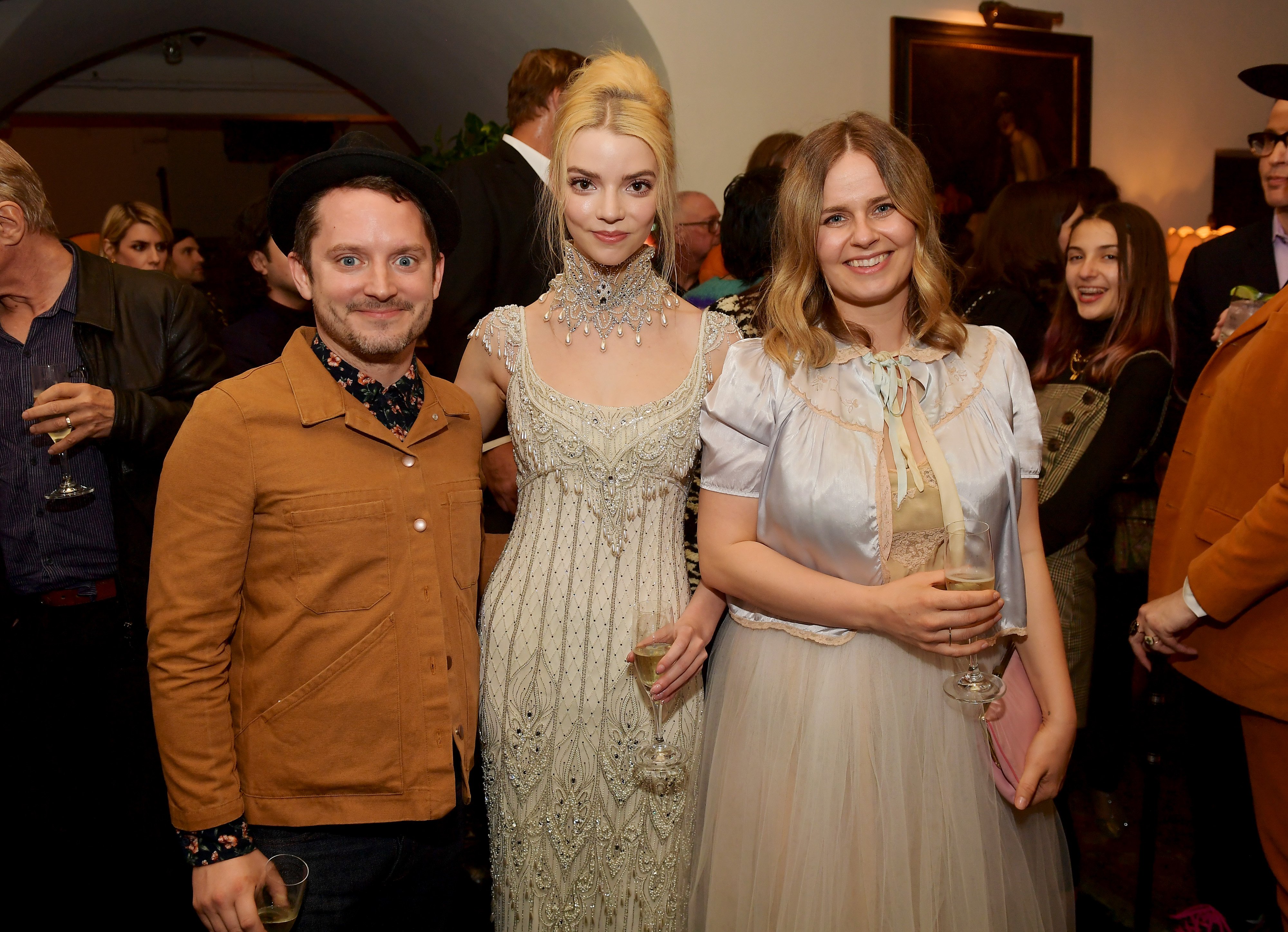 Elijah Wood, Anya Taylor-Joy, and Mette-Marie Kongsved at a Vogue and Focus Features event on February 18, 2020 | Source: Getty Images