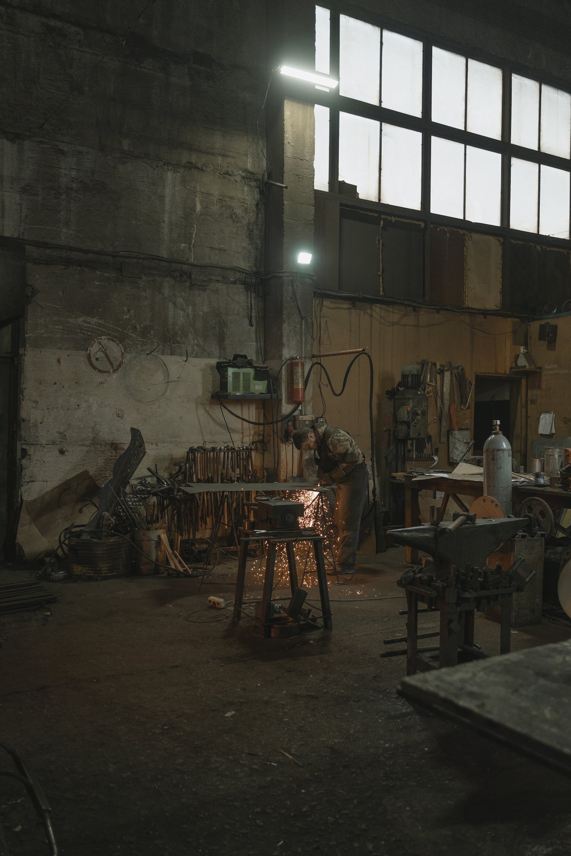 A person welding metal in a workshop | Source: Pexels